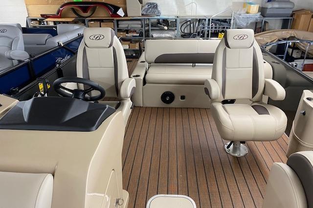 2026 Bentley Pontoons Legacy 223 Swingback interior with luxurious seating and wood-style flooring.