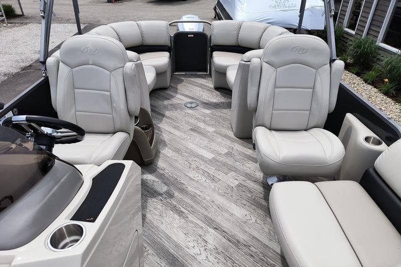 2017 Manitou 25 Oasis SE pontoon boat interior with plush seating and modern design.