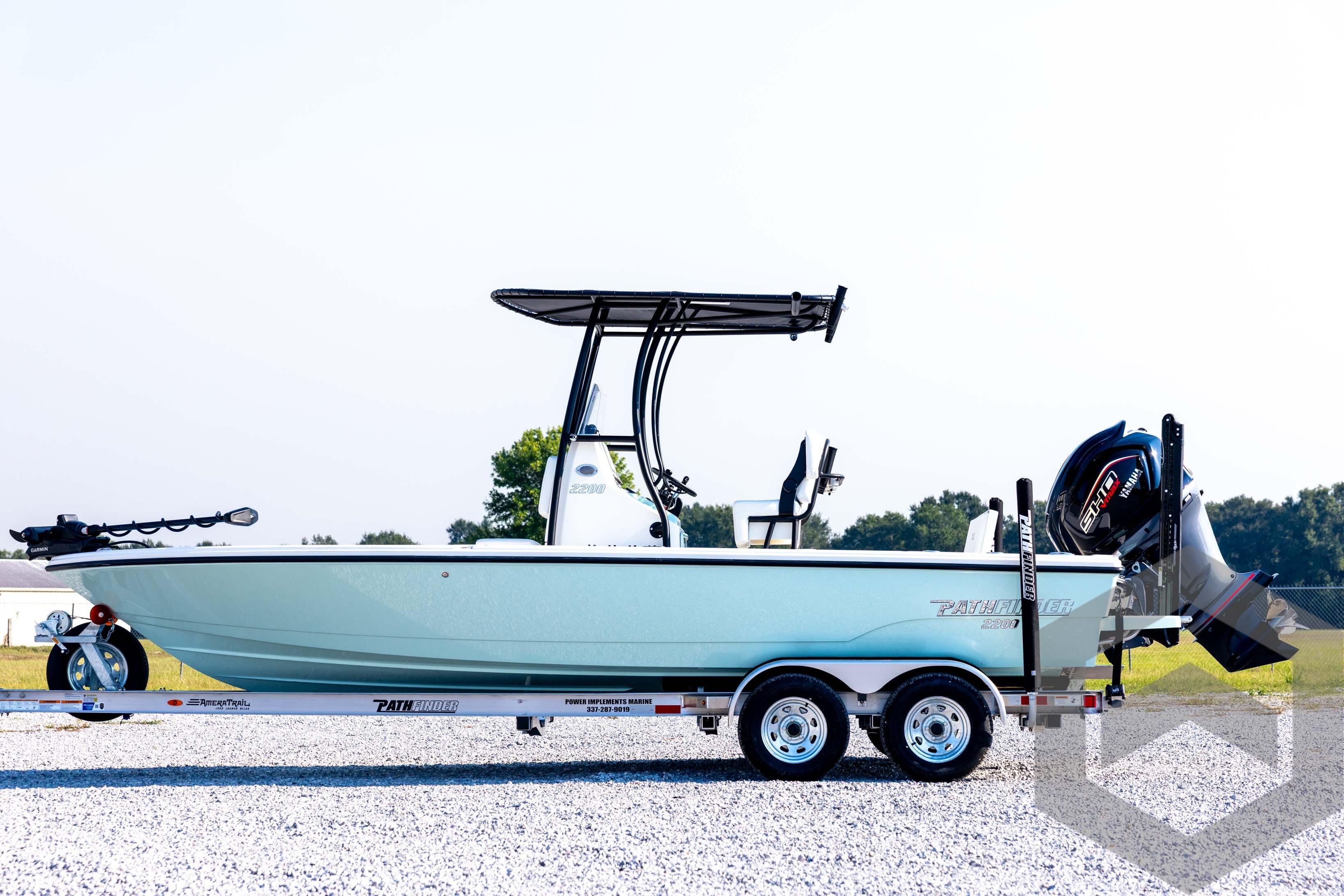 2026 Pathfinder 2200 TRS boat on trailer, side view, outdoors.