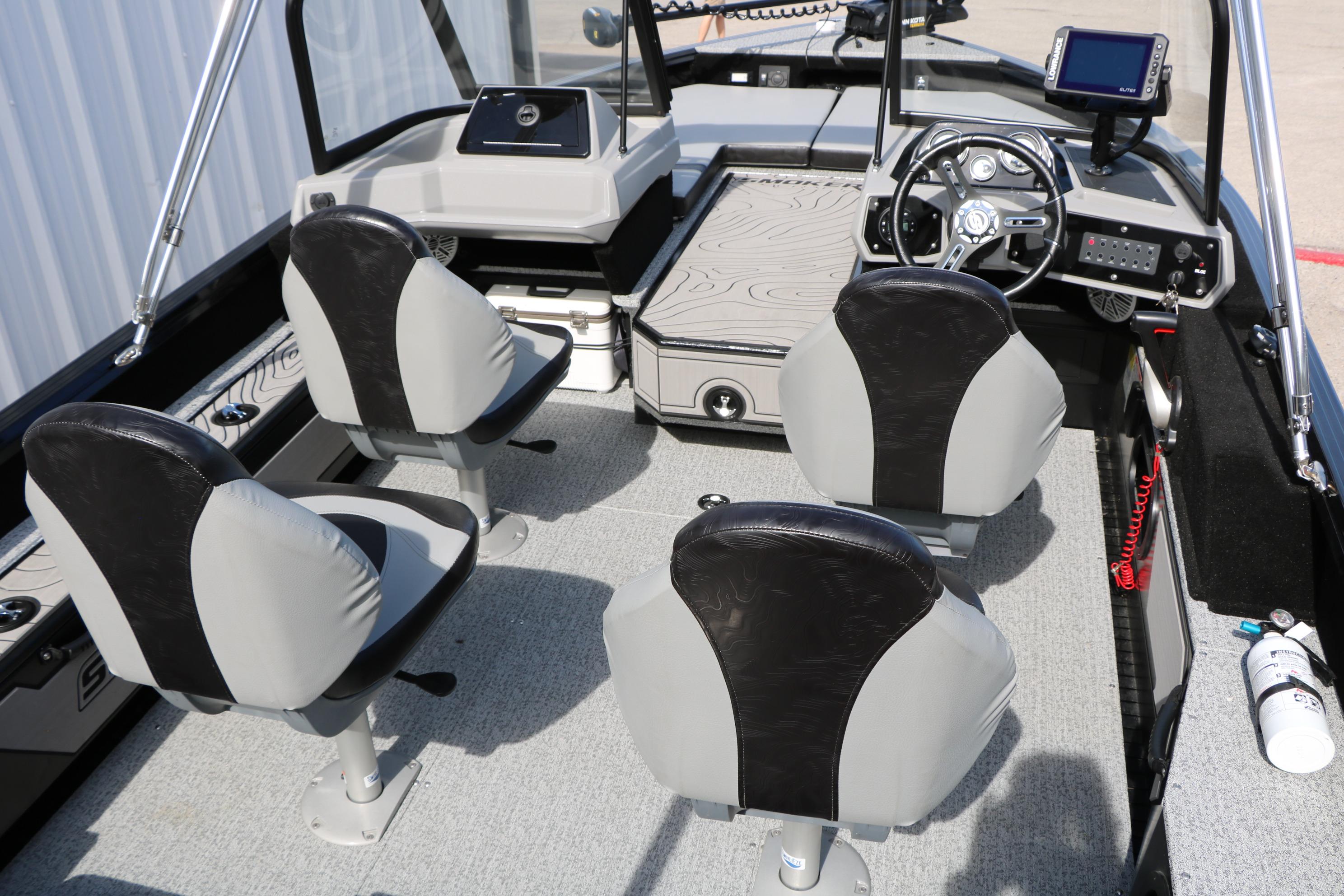 Interior of 2025 Smoker Craft Adventurer 188 DC boat with four seats and modern dashboard.