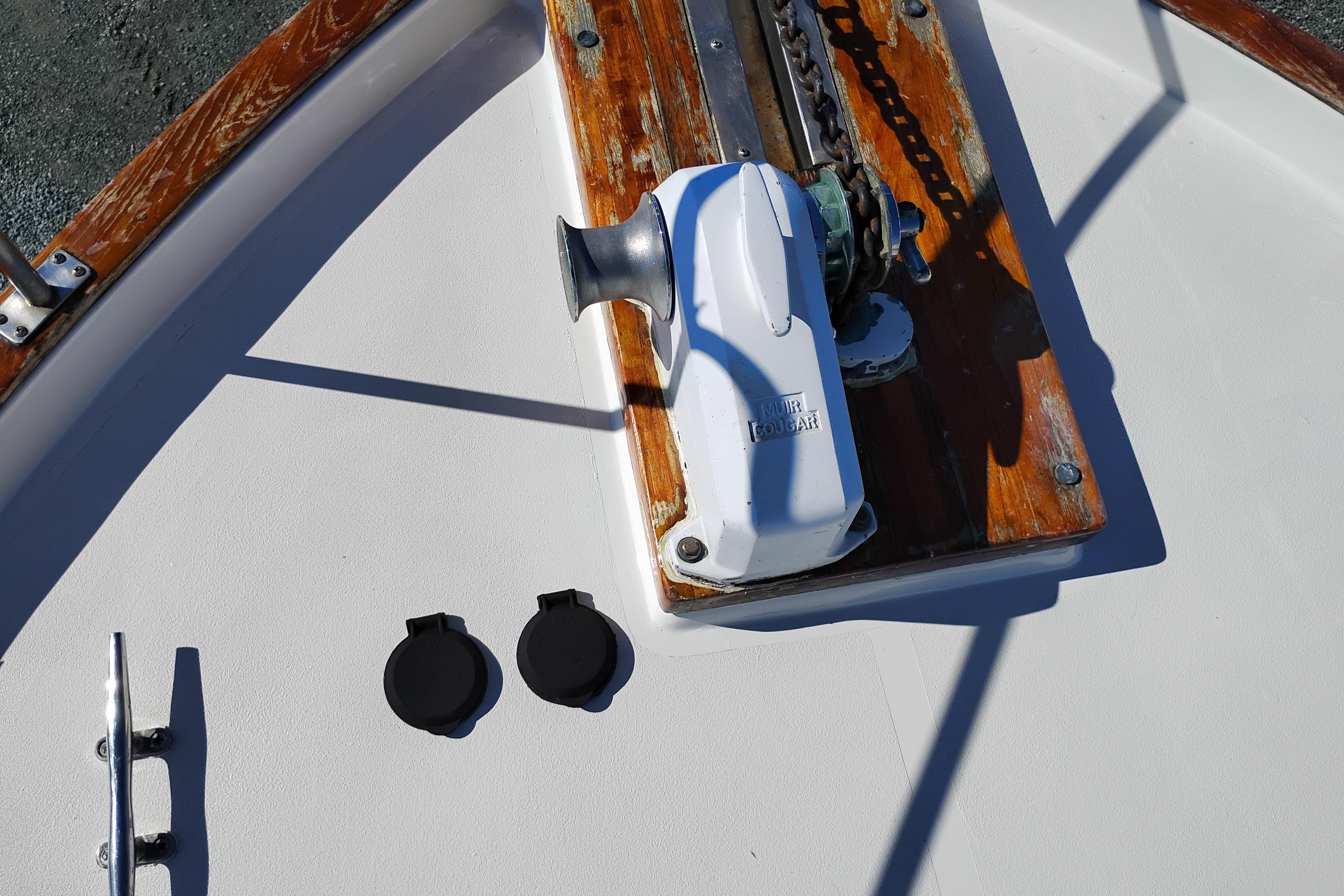 1989 Bayliner 4588 Pilothouse boat deck with anchor winch and chain.
