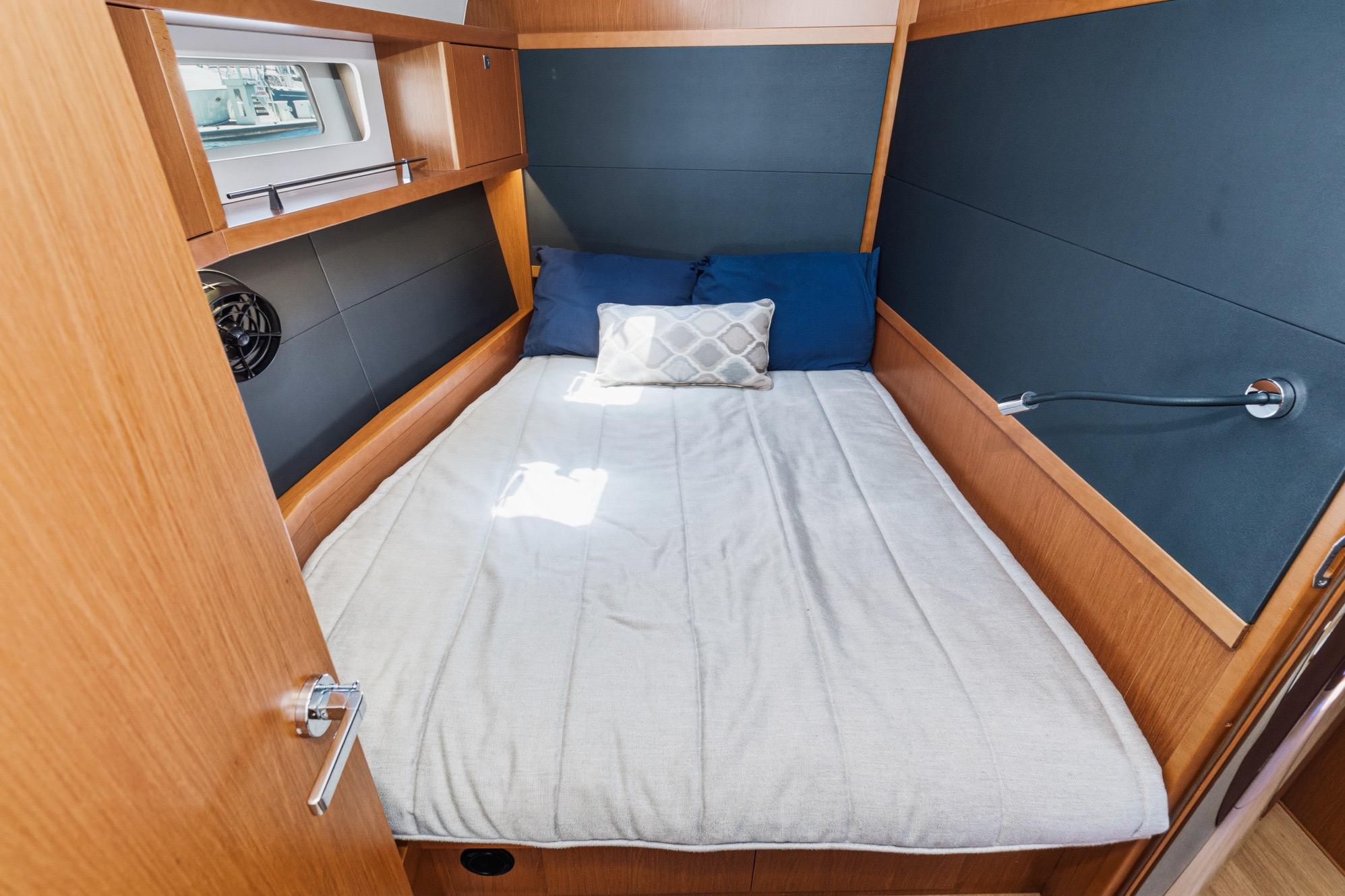 Cozy cabin interior of 2017 Beneteau Sense 50 yacht with comfortable bedding.