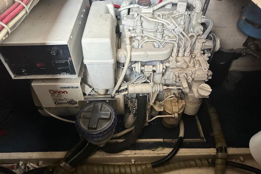 Engine room of a 1985 Egg Harbor 33 Sedan with Onan marine generator.