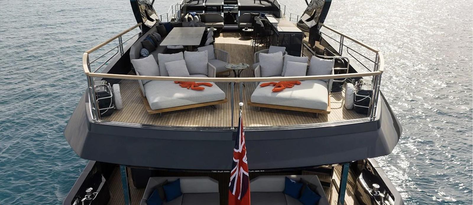 Luxurious 2023 Sunseeker 100 Yacht with spacious deck and elegant seating on the water.