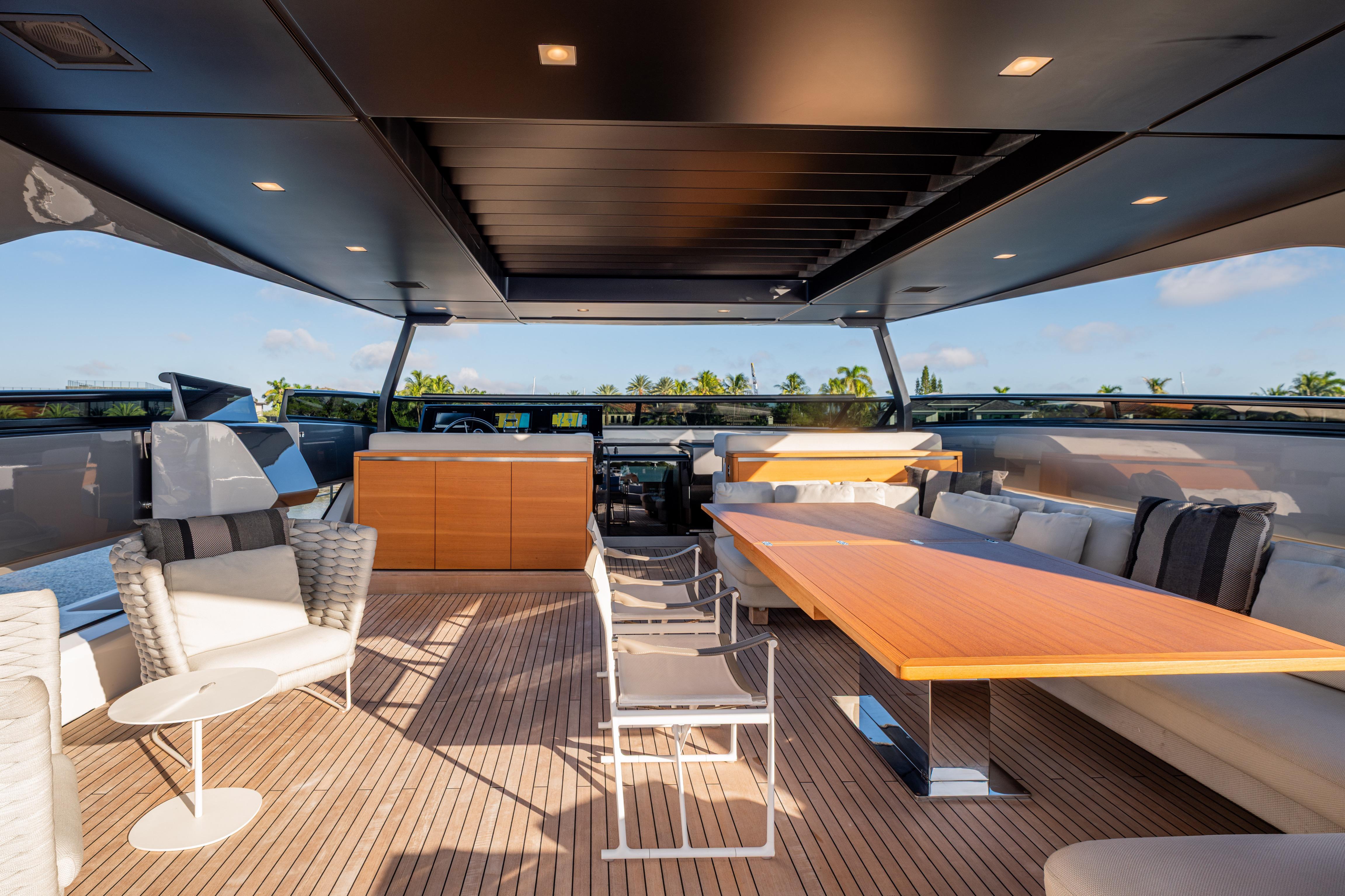 Luxurious 2023 Sanlorenzo SL120A yacht deck with elegant seating and dining area.