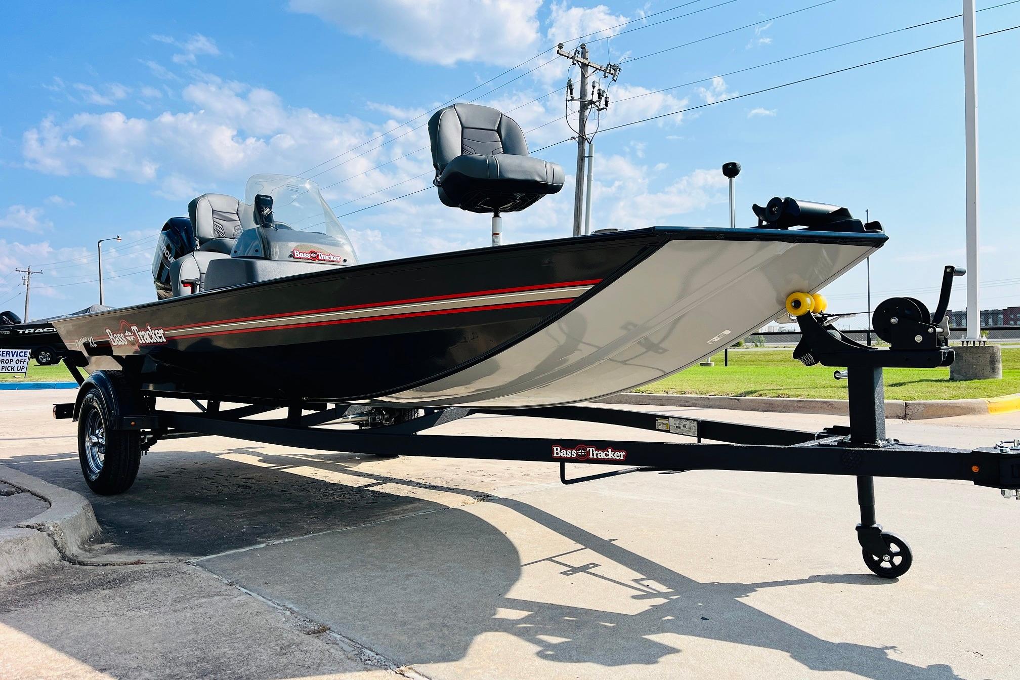 2026 Tracker Bass Tracker Classic XL boat on trailer, parked outdoors under blue sky.