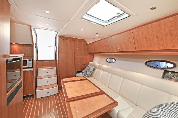 Luxurious interior of 2008 Tiara Yachts 4200 Open, featuring elegant wood finishes and comfortable seating.