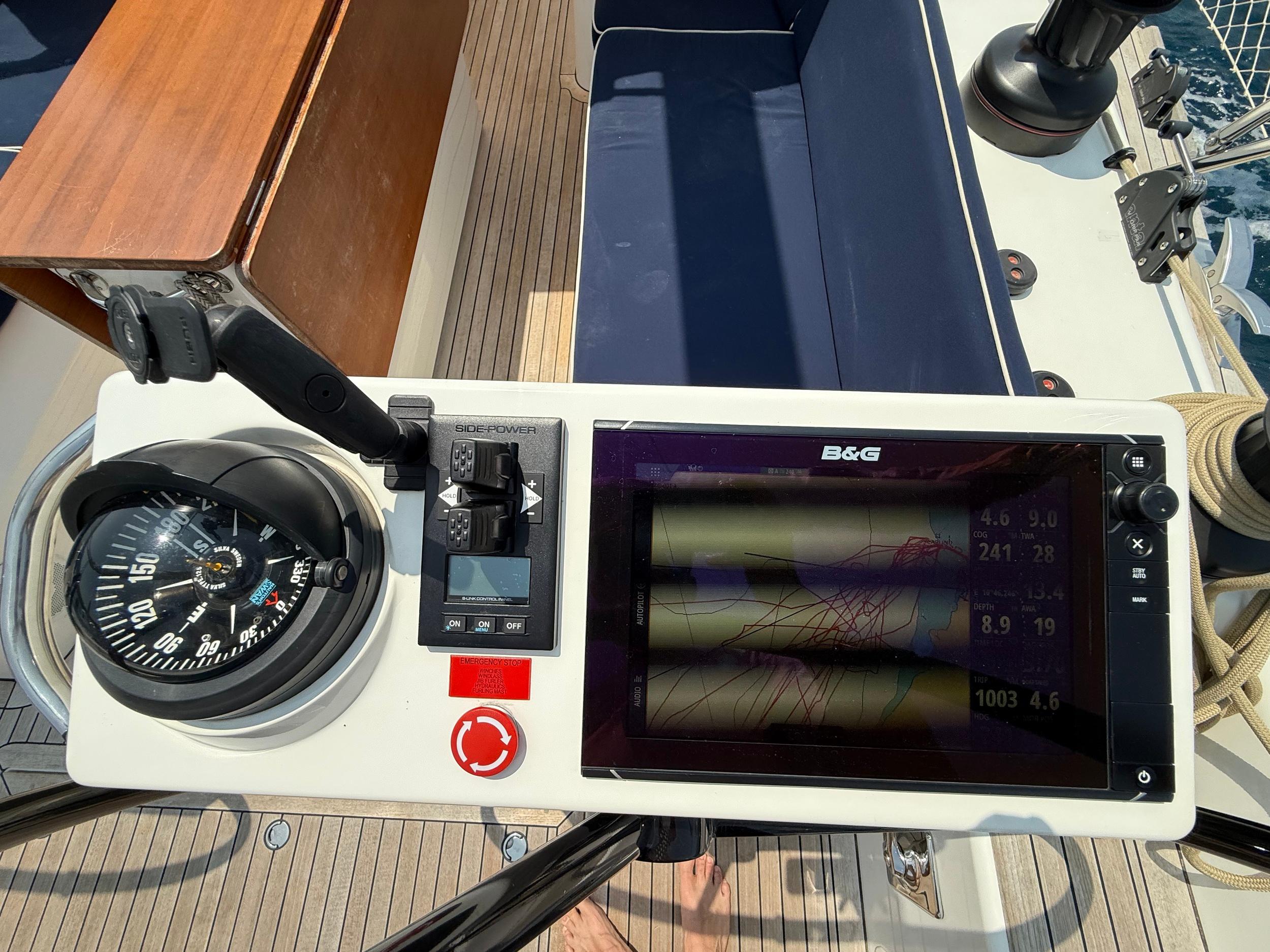 Cockpit of 2016 Nautor Swan 54 with navigation equipment and compass.