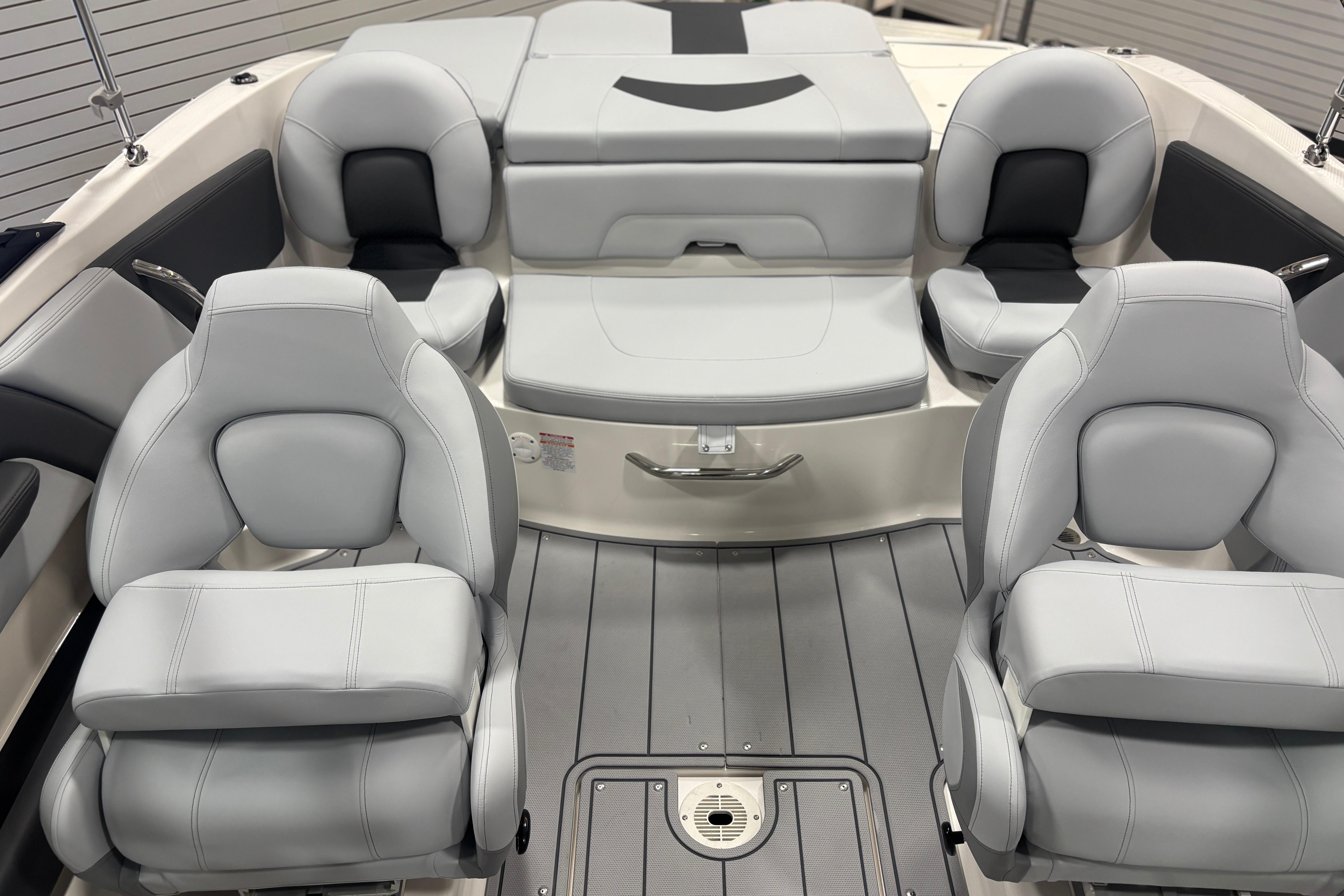 Interior of 2026 Chaparral 21 SSi Ski & Fish with gray seating.