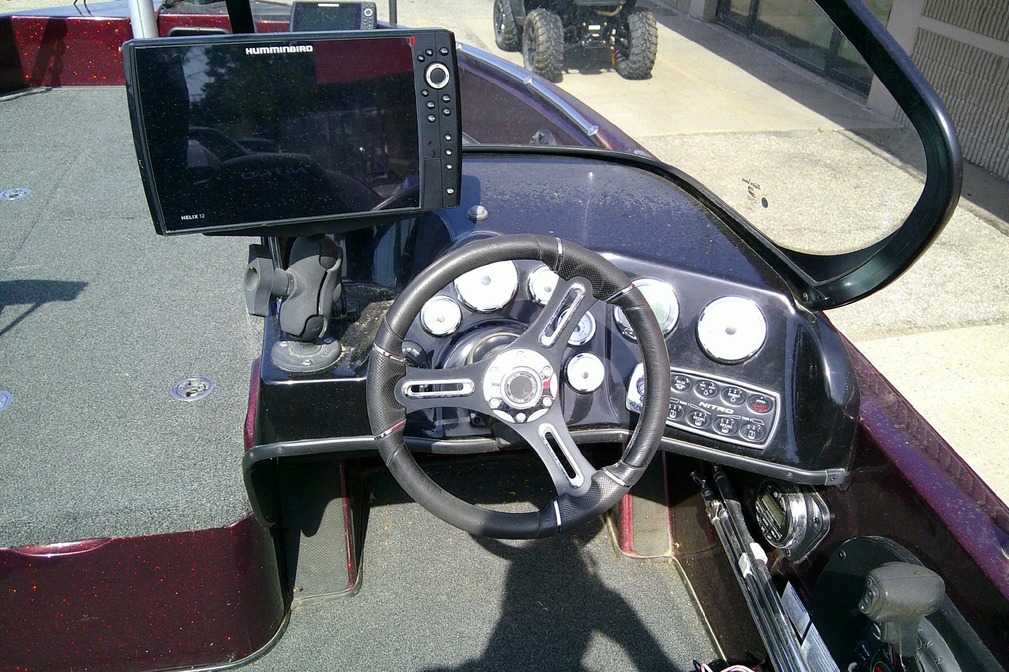 2019 Nitro ZV19 Sport boat dashboard with steering wheel and Humminbird Helix 12 fishfinder.