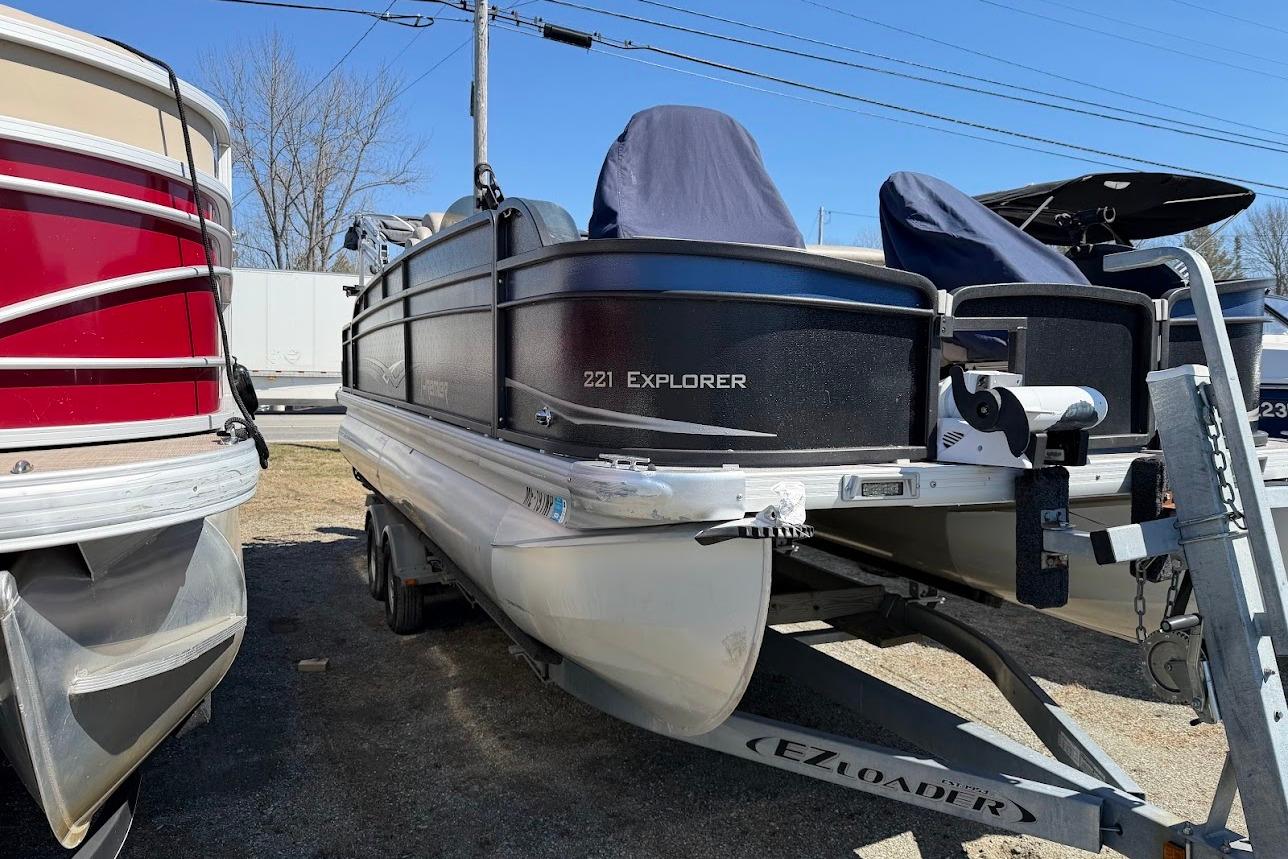 2013 Premier 221 Explorer pontoon boat on trailer, parked outdoors.