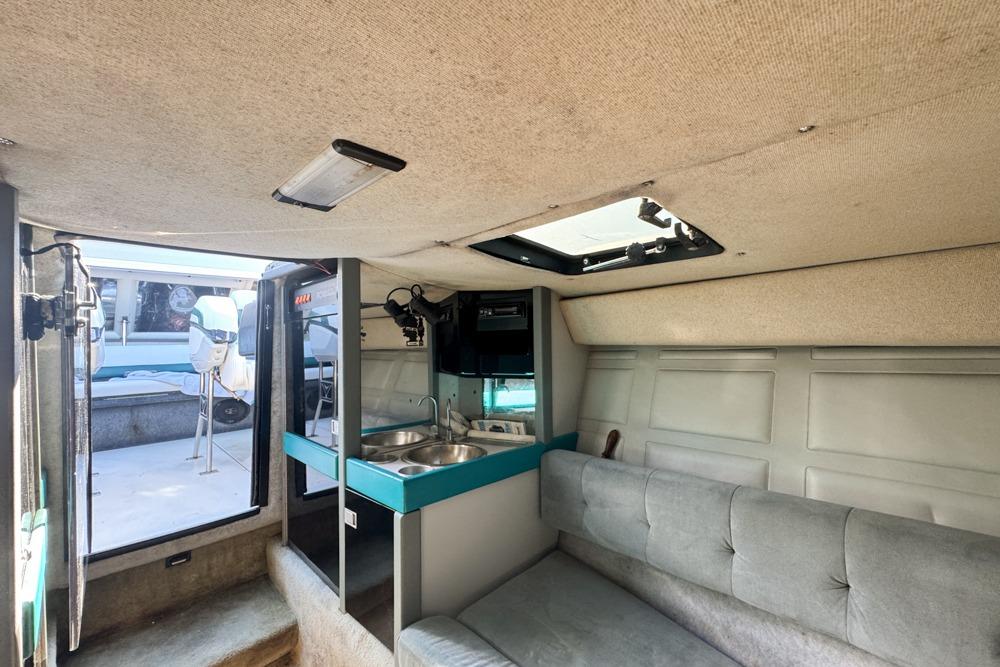 Interior of 1989 Formula 292 SR-1 boat with kitchenette and seating area.