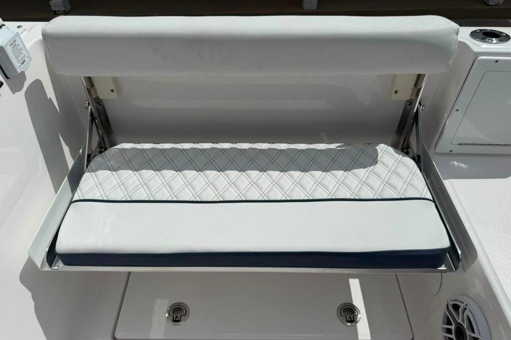 2026 Sea Fox 288 Traveler boat seat with white cushioned upholstery and diamond stitching.