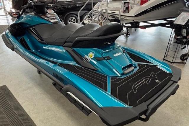 2026 Yamaha WaveRunner FX Cruiser SVHO in showroom, featuring sleek design and vibrant blue color.