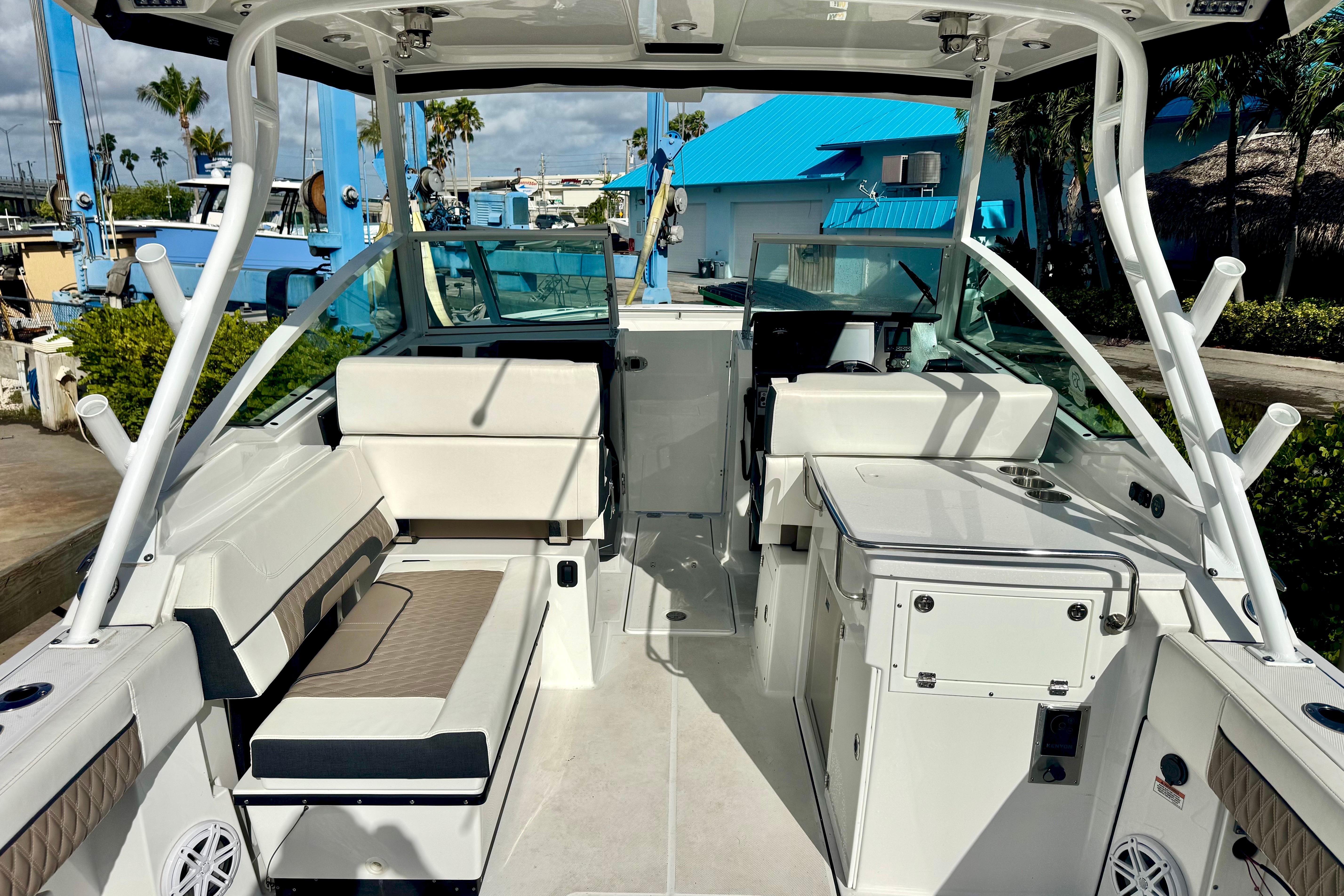 2023 Blackfin 272 DC boat interior with seating and helm, docked at marina.
