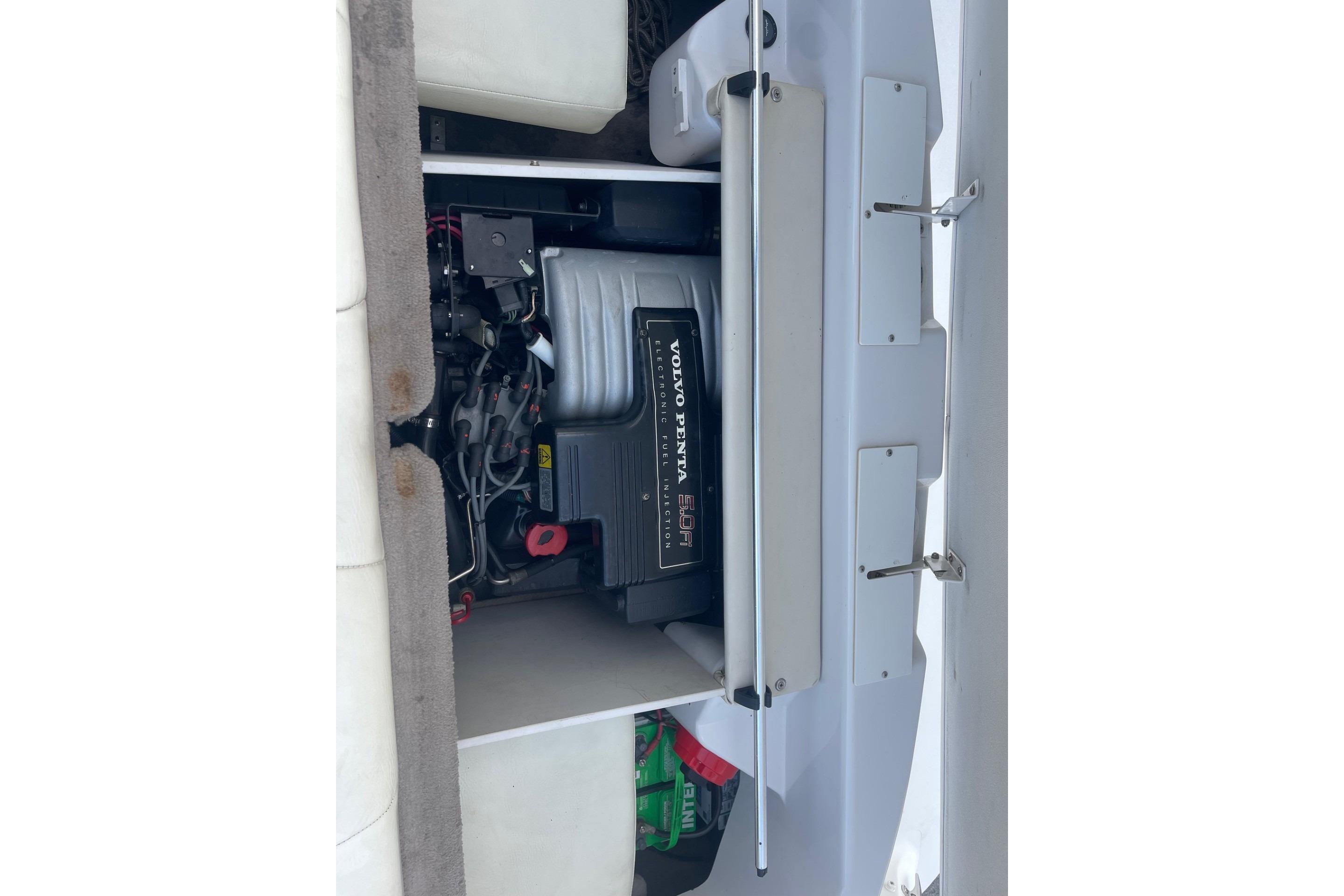 1996 Four Winns 200 Horizon boat engine compartment with Volvo Penta engine visible.