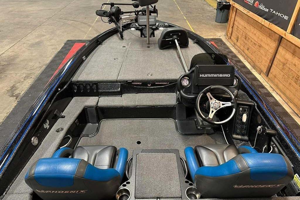2017 Phoenix 919 ProXP boat interior with steering wheel and dual seats.