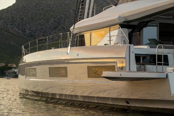 2025 Lagoon 60 yacht on calm water, showcasing sleek design and modern features.