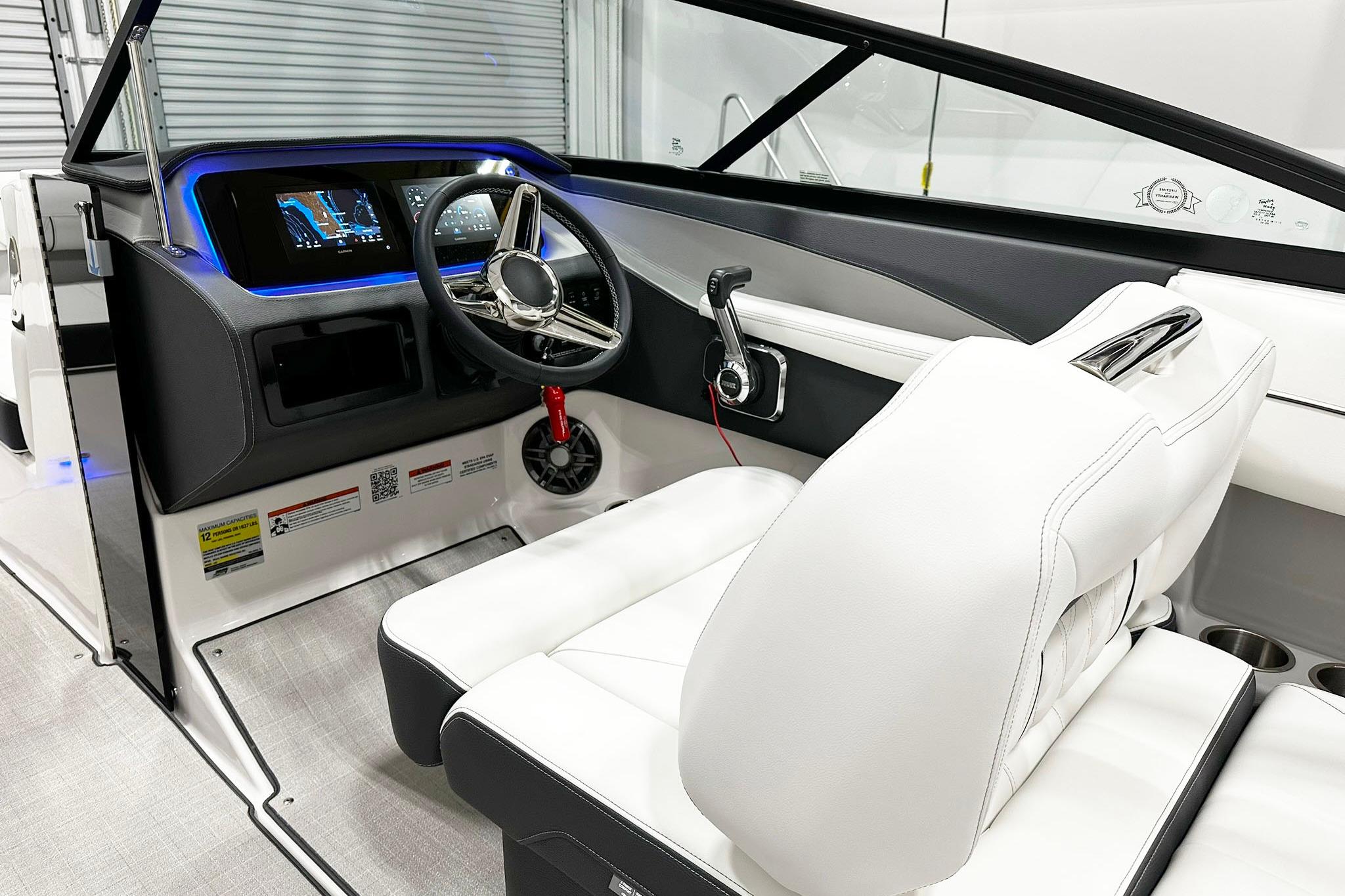 2025 Regal LS2 boat interior with modern dashboard and white leather seating.