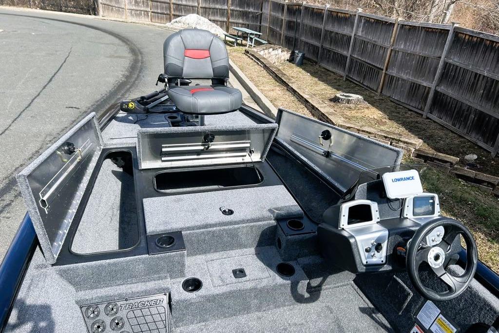 2026 Tracker Pro Team 195 boat interior with storage compartments and navigation equipment.