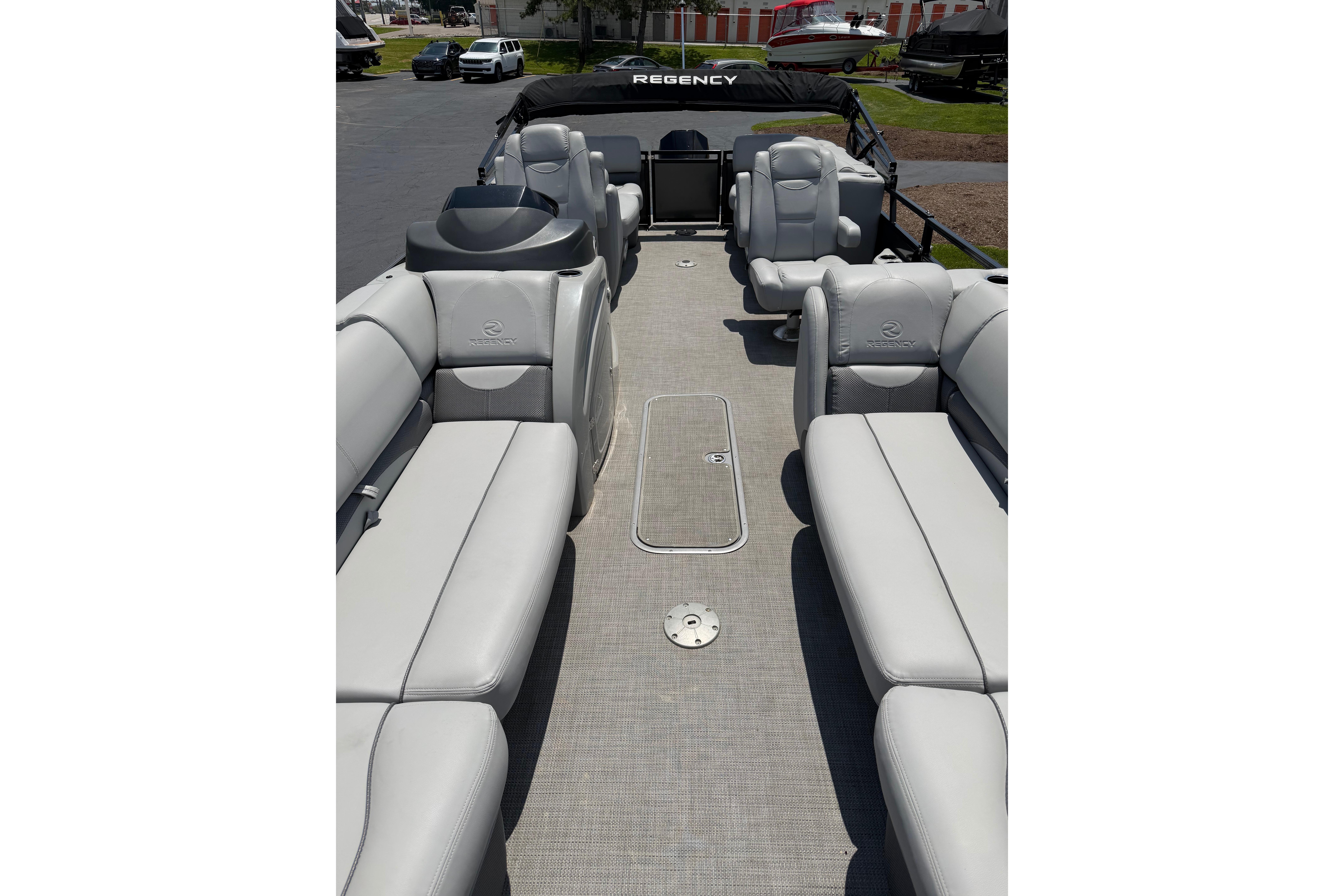 2019 Regency 230 DL3 pontoon boat with spacious seating and sleek design.