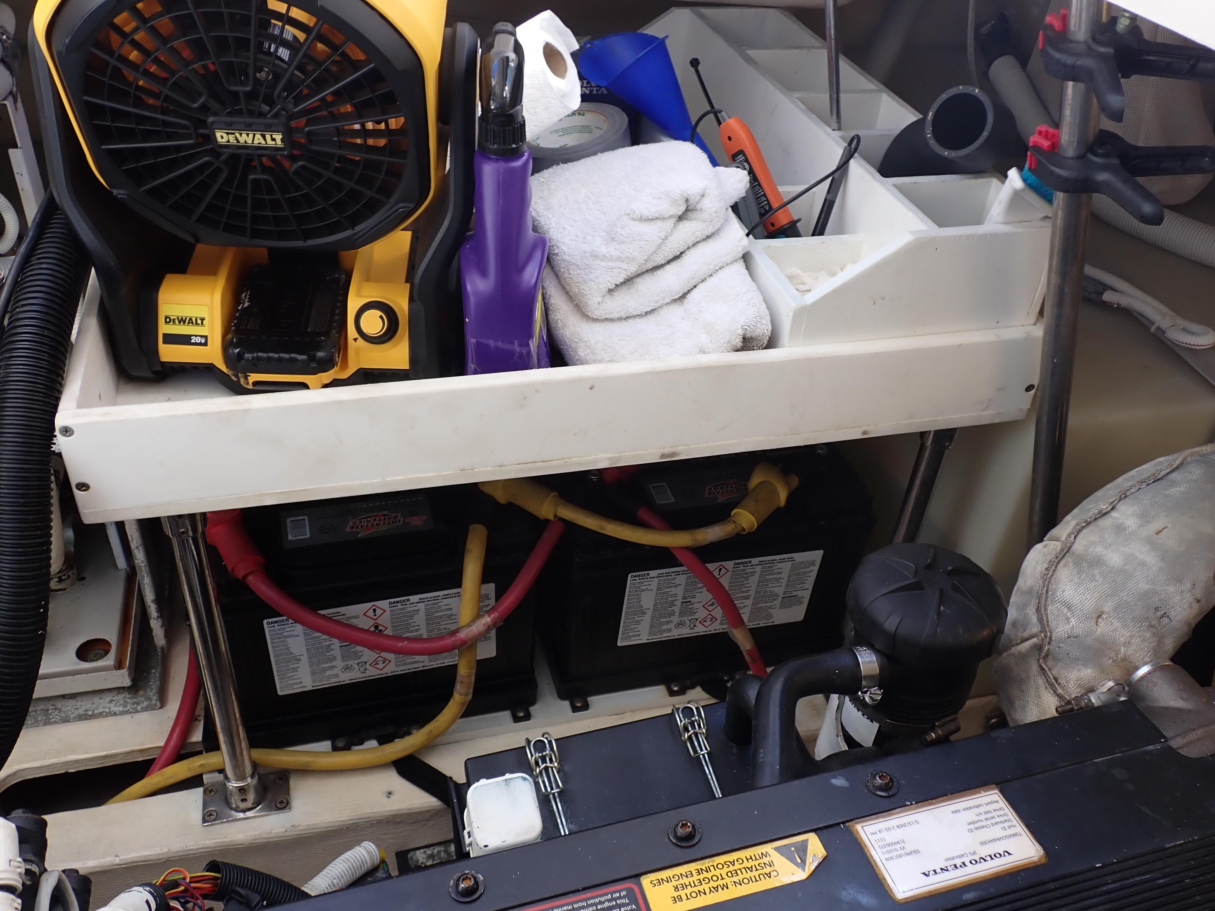 Storage compartment in a 2009 Tiara Yachts 4300 Sovran with tools and equipment.