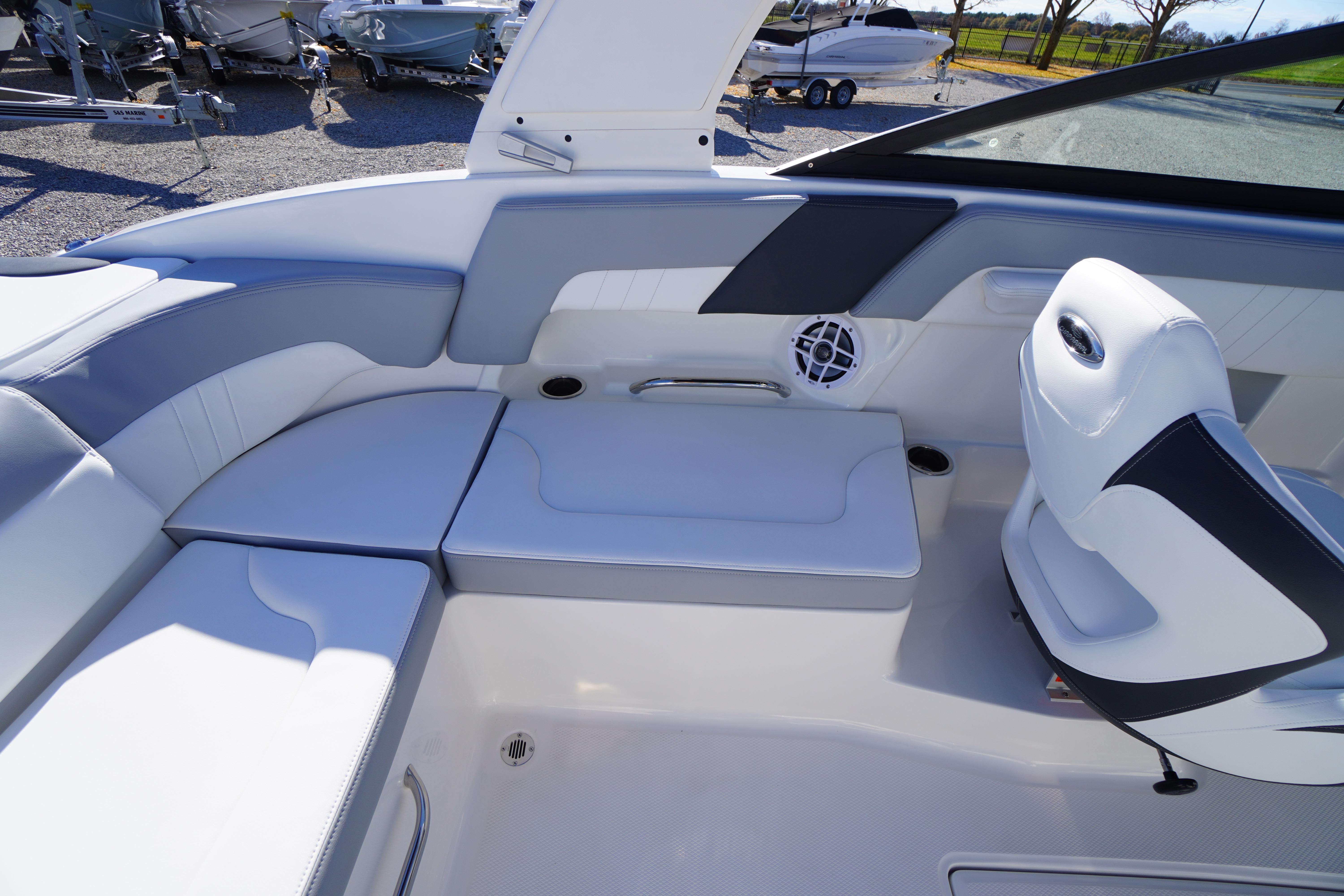 2026 Chaparral 23 SSi boat interior with white seating and cup holders.