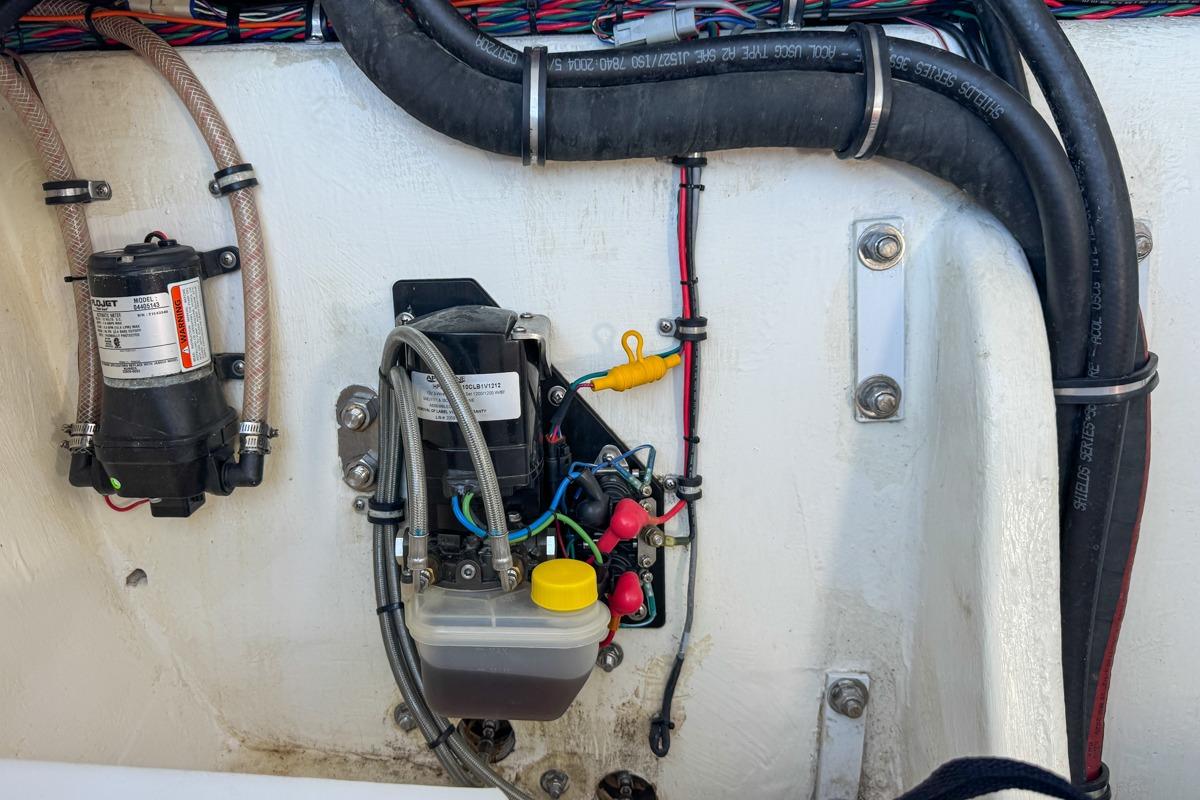 Engine compartment of 2022 Velocity 290sc boat with wiring and components.