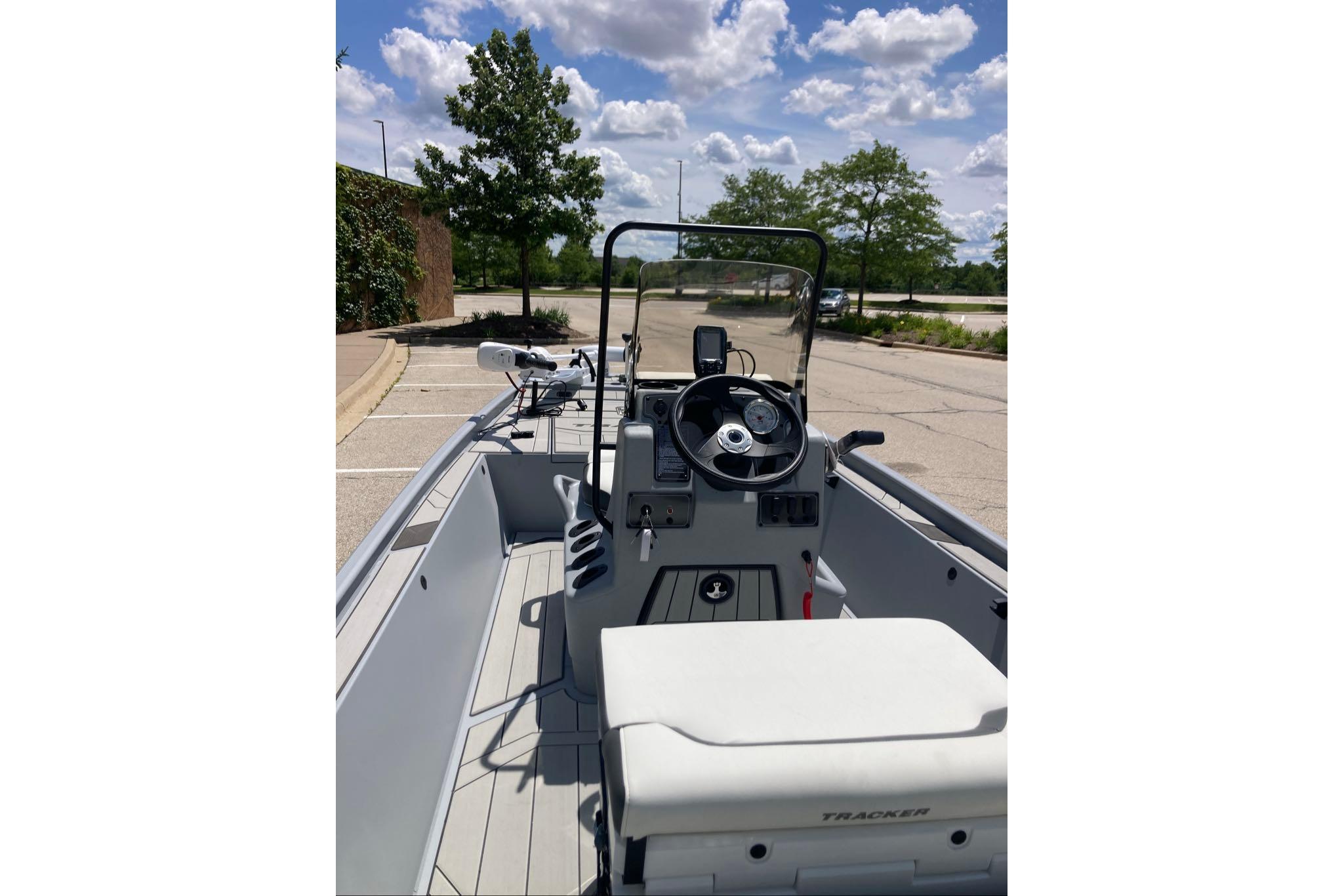 2026 Tracker Bass Tracker Classic CC boat interior with steering wheel and seating.