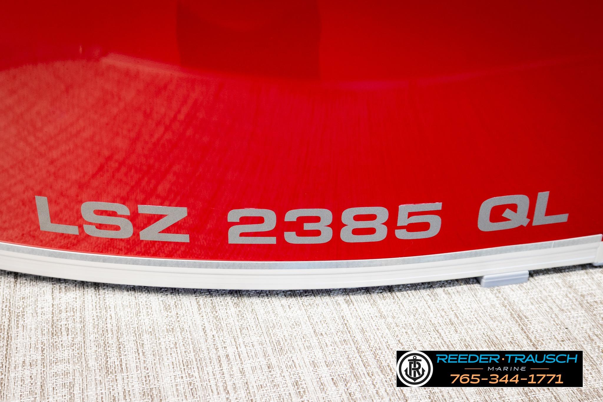 Red Avalon LSZ 2385 QL boat with Reeder-Trausch Marine branding.