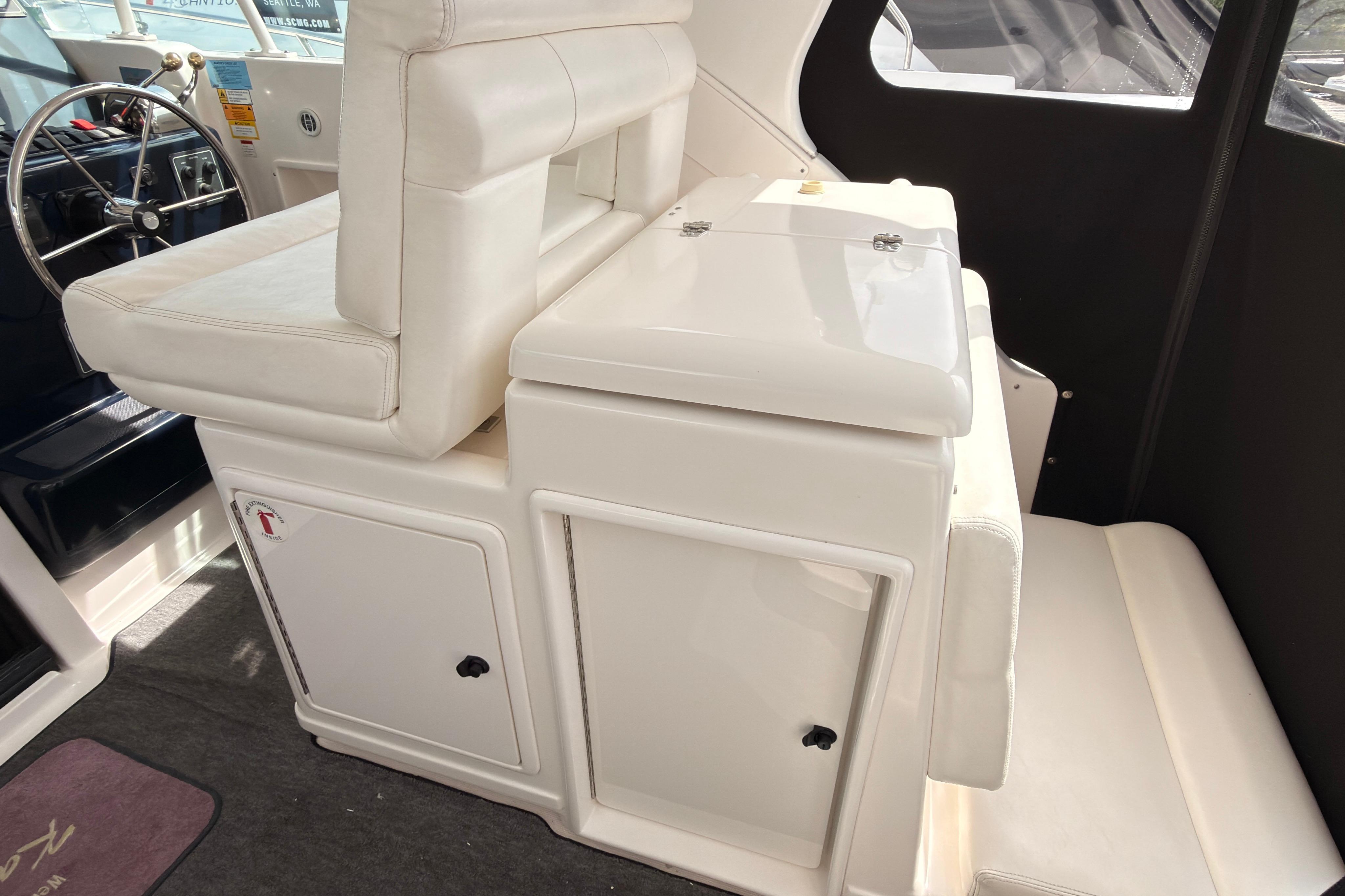 2002 Tiara Yachts 3500 Open interior with white seating and storage compartments.