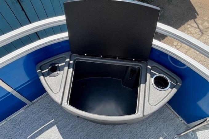 2026 Sun Tracker Fishin' Barge 20 DLX storage compartment with cup holders.
