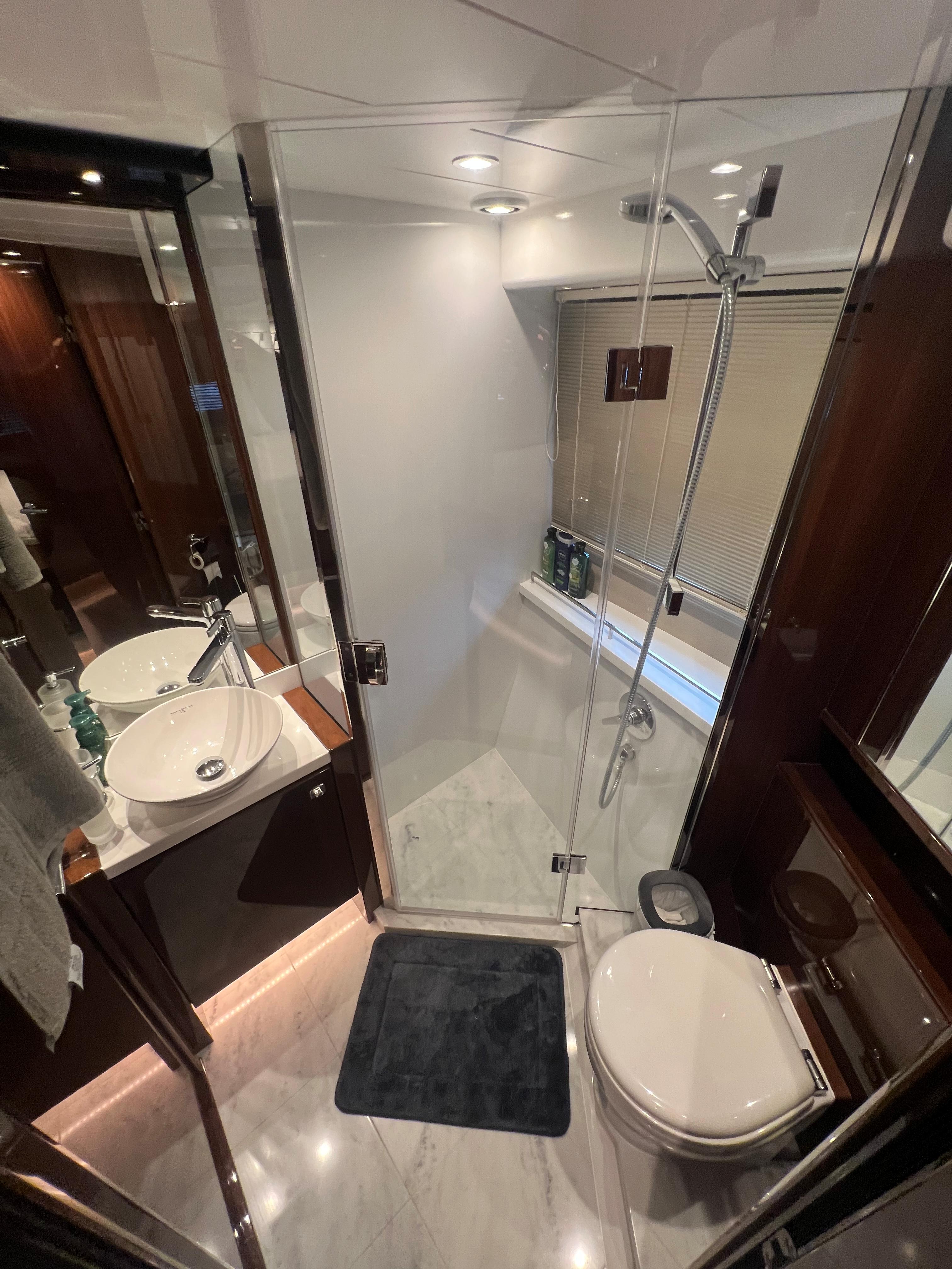 Luxurious bathroom in 2018 Princess V58 yacht with modern fixtures and elegant design.