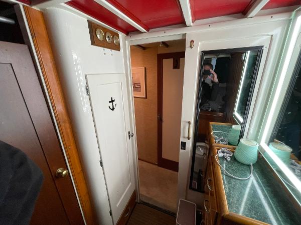 Interior of a 1951 Chris-Craft Catalina boat with nautical decor and wooden accents.