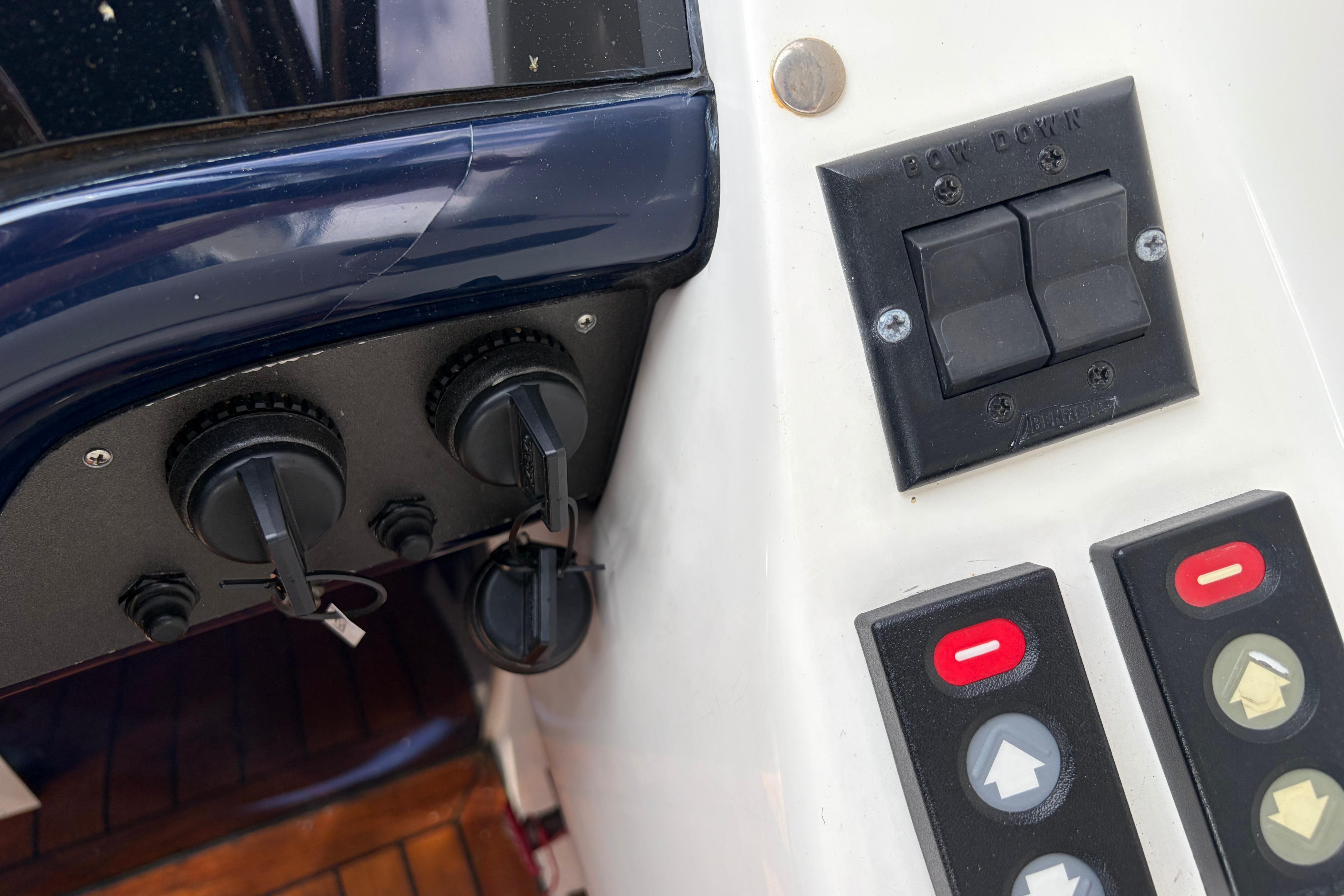 Control panel of a 2000 Sunseeker Superhawk 34 yacht with switches and dials.