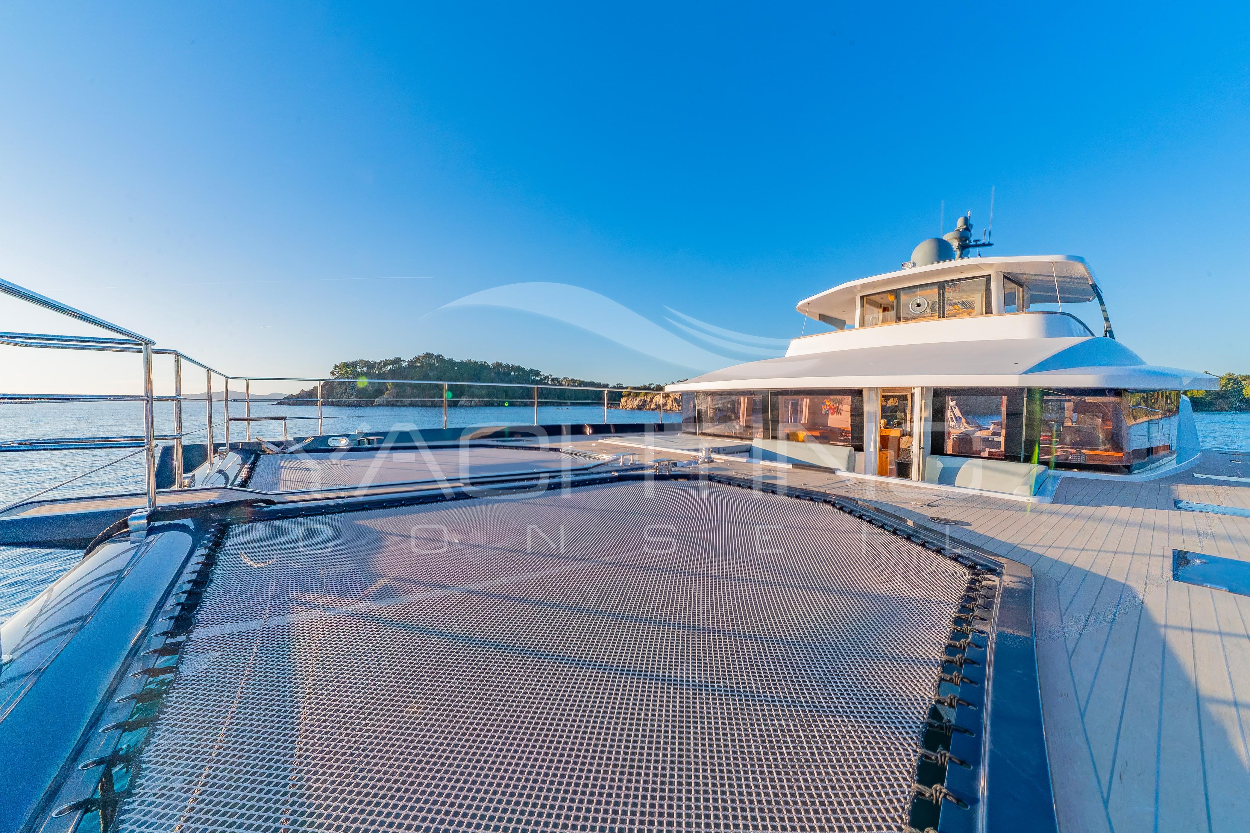Luxurious 2022 JFA Yachts Long Island 78 catamaran on serene blue waters.