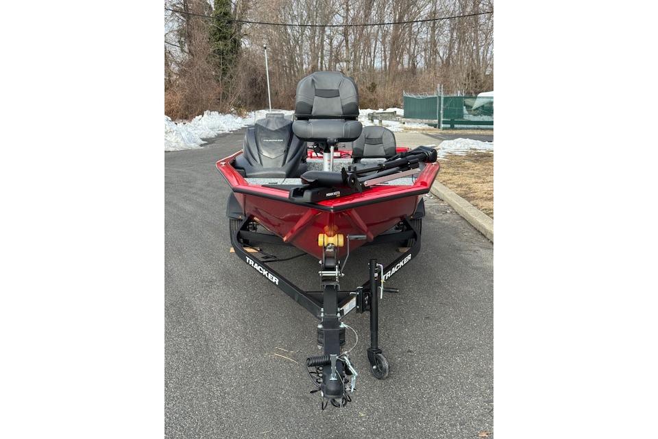 2026 Tracker Pro Team 175 Crappie Edition boat on trailer, parked on a snowy road.