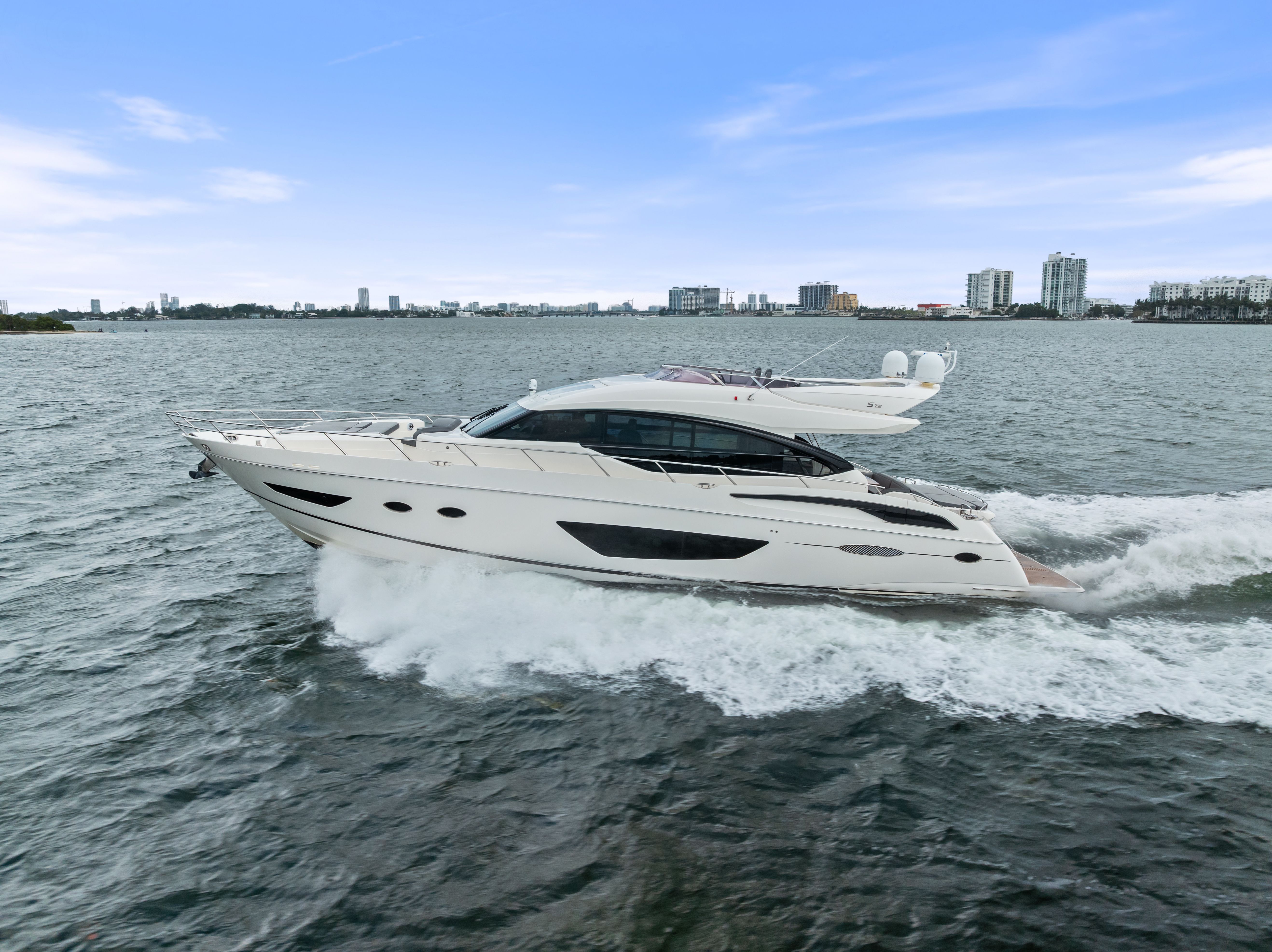 2014 Princess S72 luxury yacht cruising on water.