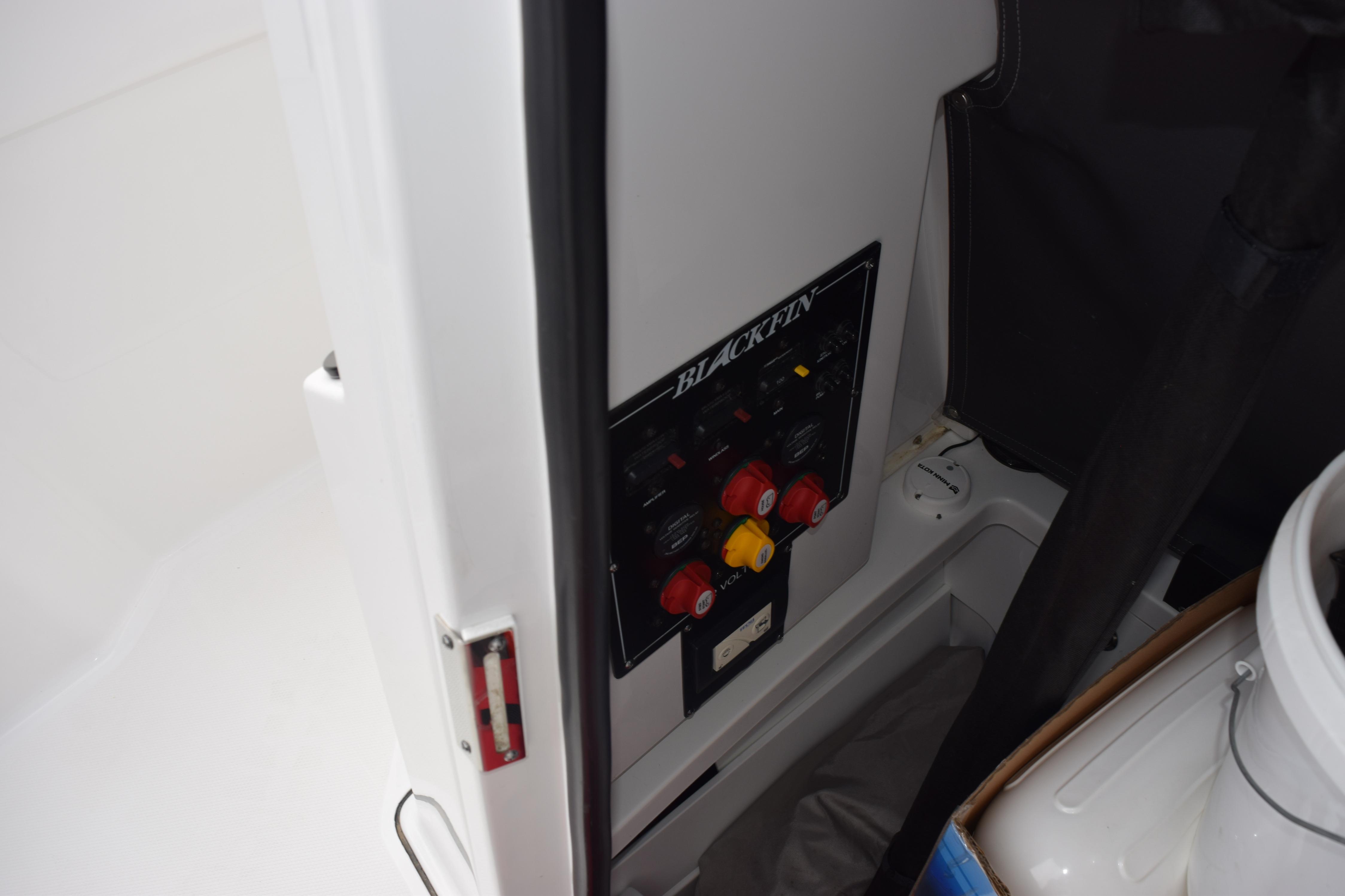 2023 Blackfin 252 CC boat control panel with switches and labels.