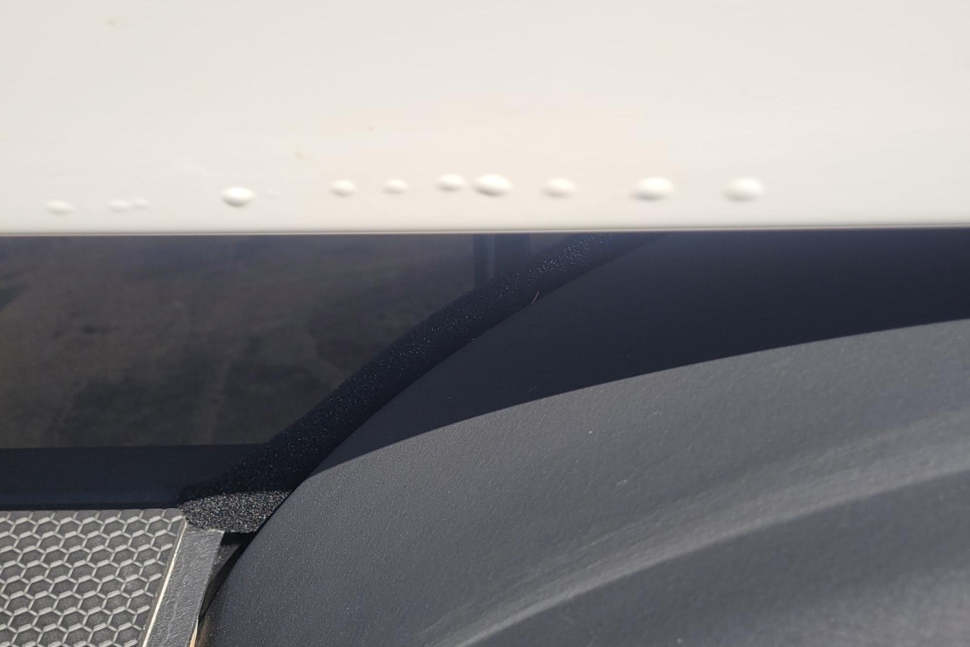 Close-up of 2024 Tahoe 1950 boat detailing with textured surface and rivets.