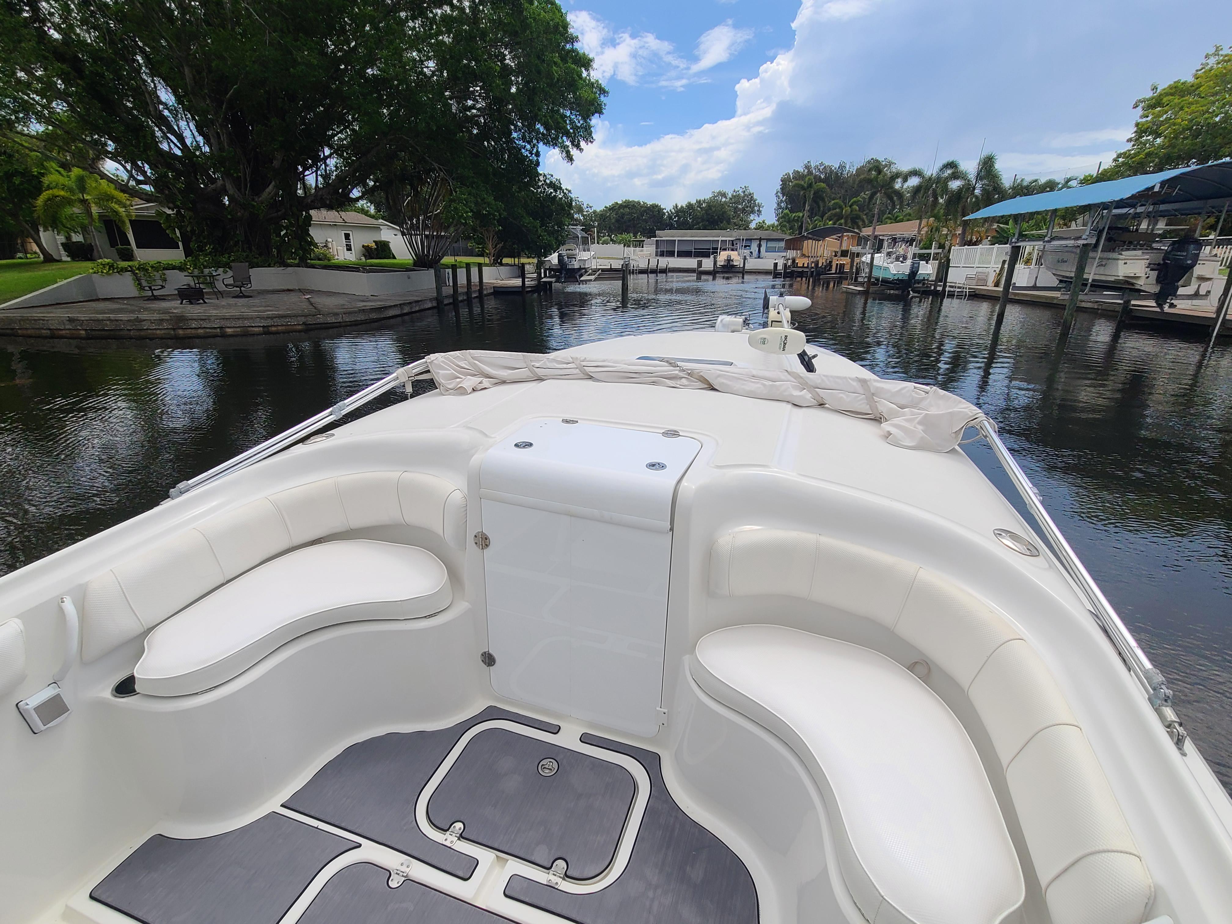 2009 Glasstream 360 SCX boat interior, docked in a serene marina.