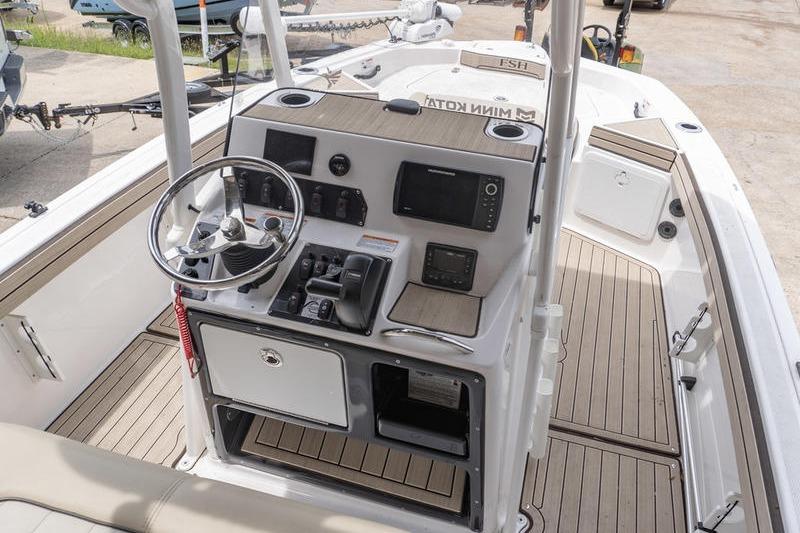 2023 Yamaha Boats 195 FSH Sport dashboard with steering wheel and controls.