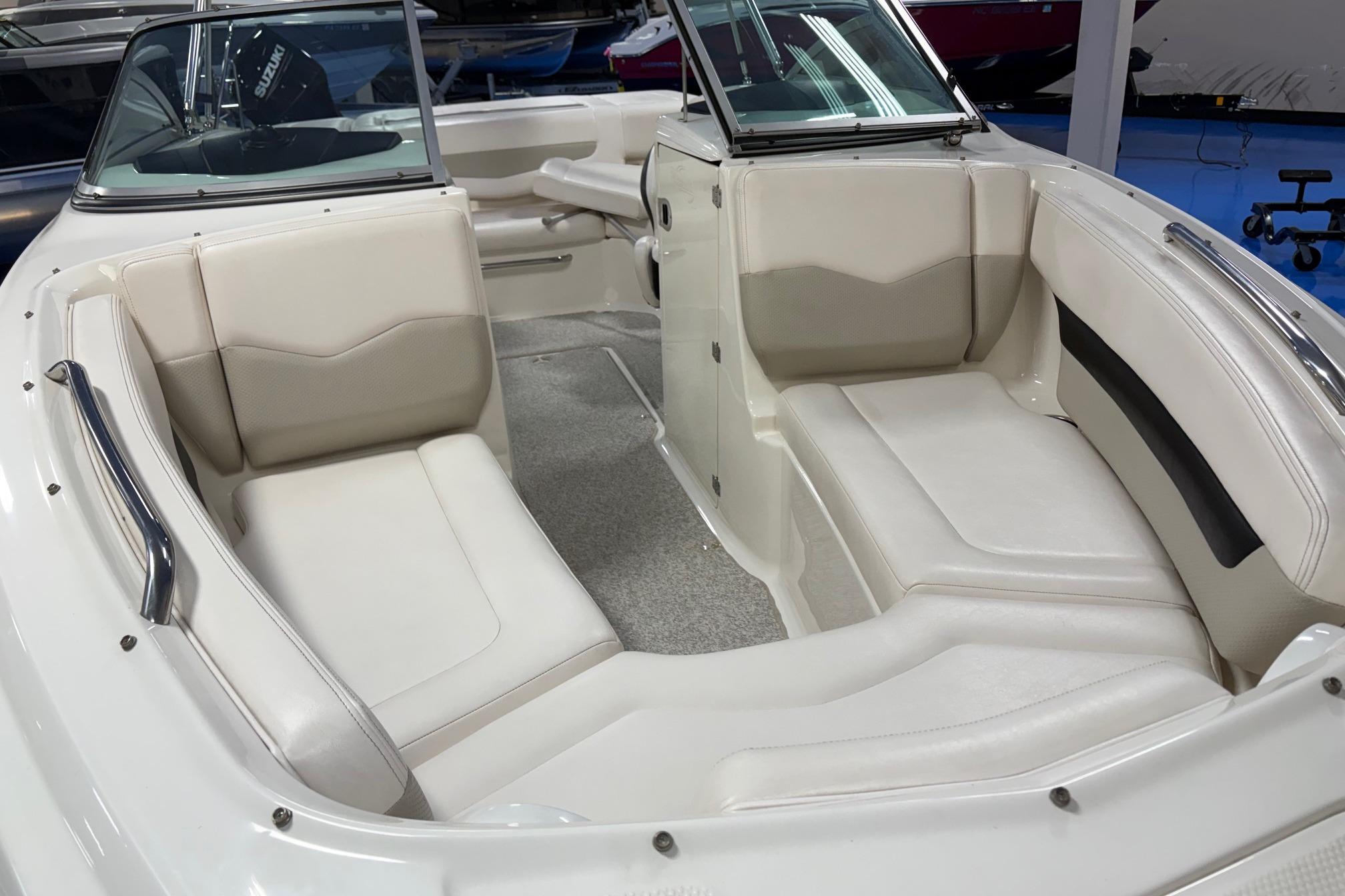 2011 Chaparral 216 SSi boat interior with white seating and sleek design.