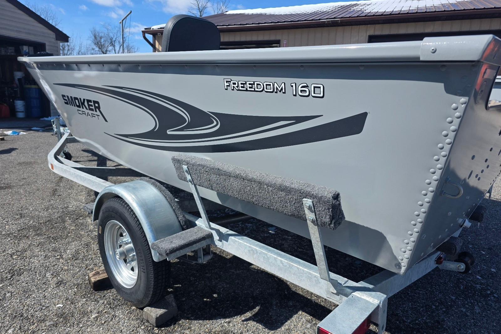 2026 Smoker Craft Freedom 160 TL boat on trailer, parked outdoors.