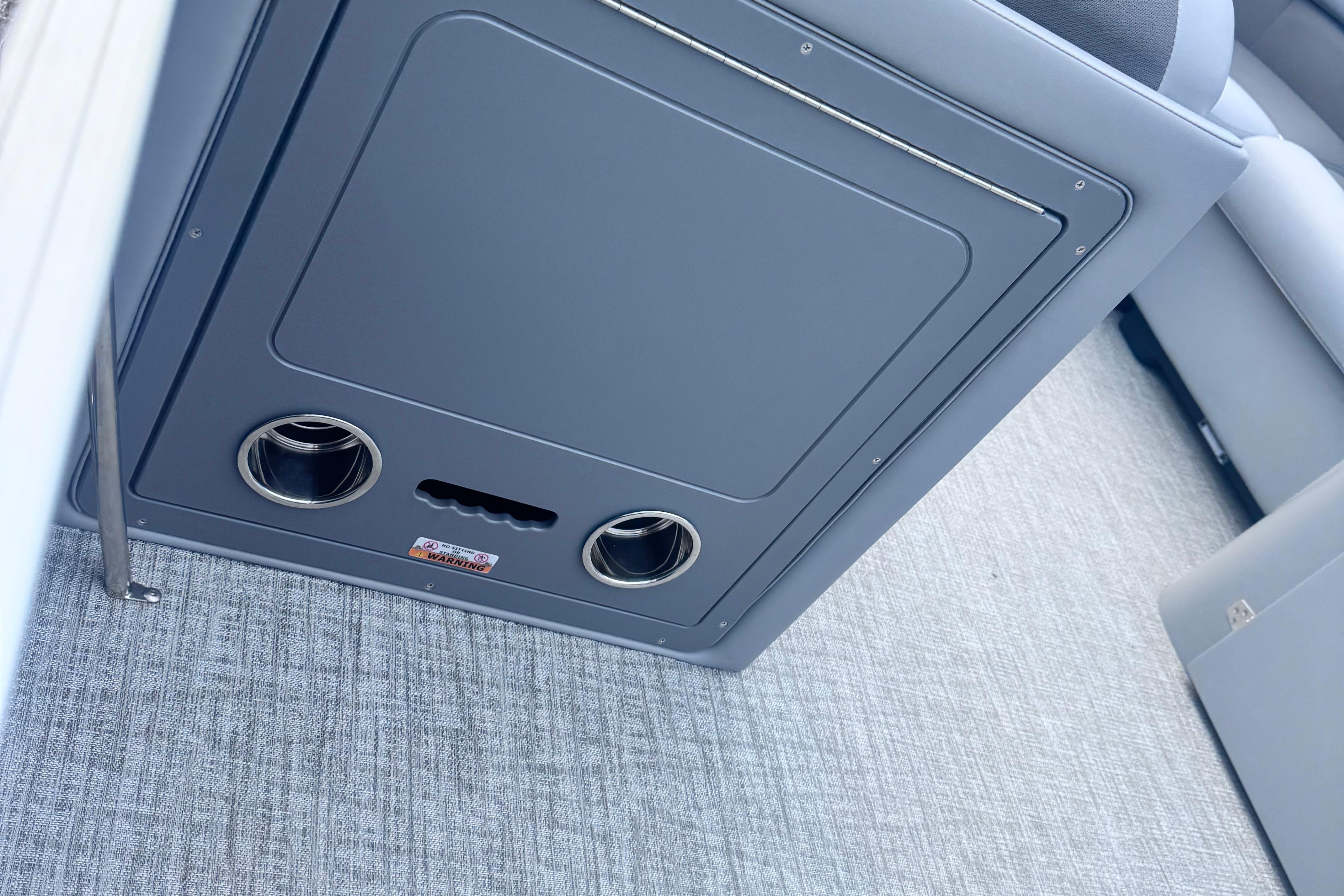Interior of 2026 Landau ISLAND BREEZE 21 with cup holders and storage compartment.