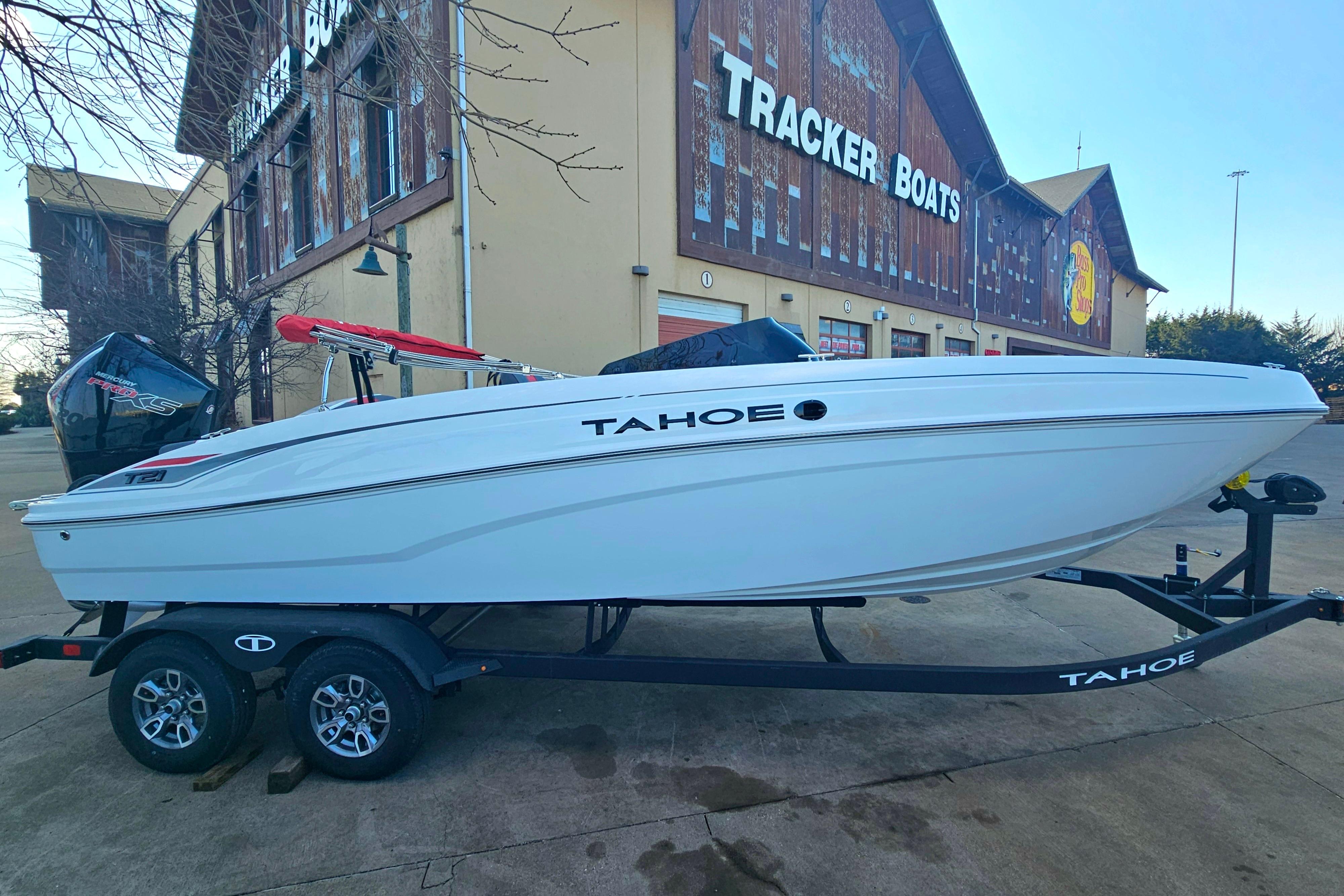 2026 Tahoe T21 boat on trailer outside Tracker Boats store.