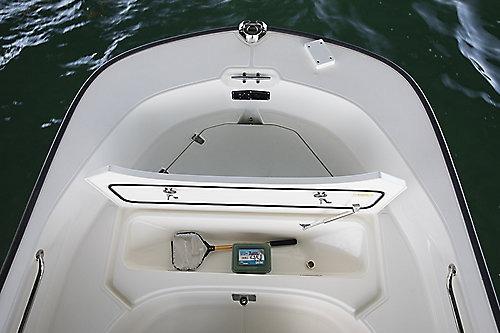 2026 Boston Whaler 170 Montauk boat interior with open storage compartment.