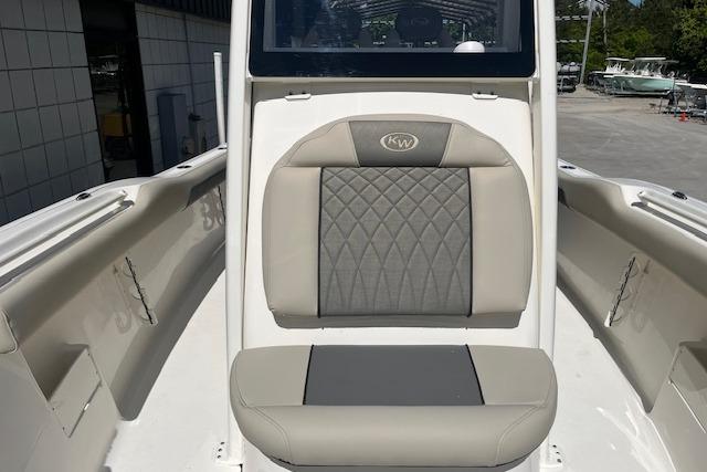 2026 Key West 239 FS boat interior with cushioned seating and sleek design.