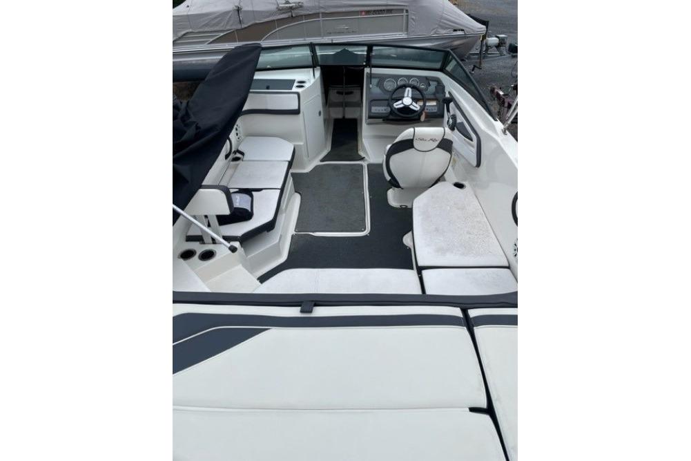 2015 Sea Ray 210 SLX boat interior with seating and steering wheel.