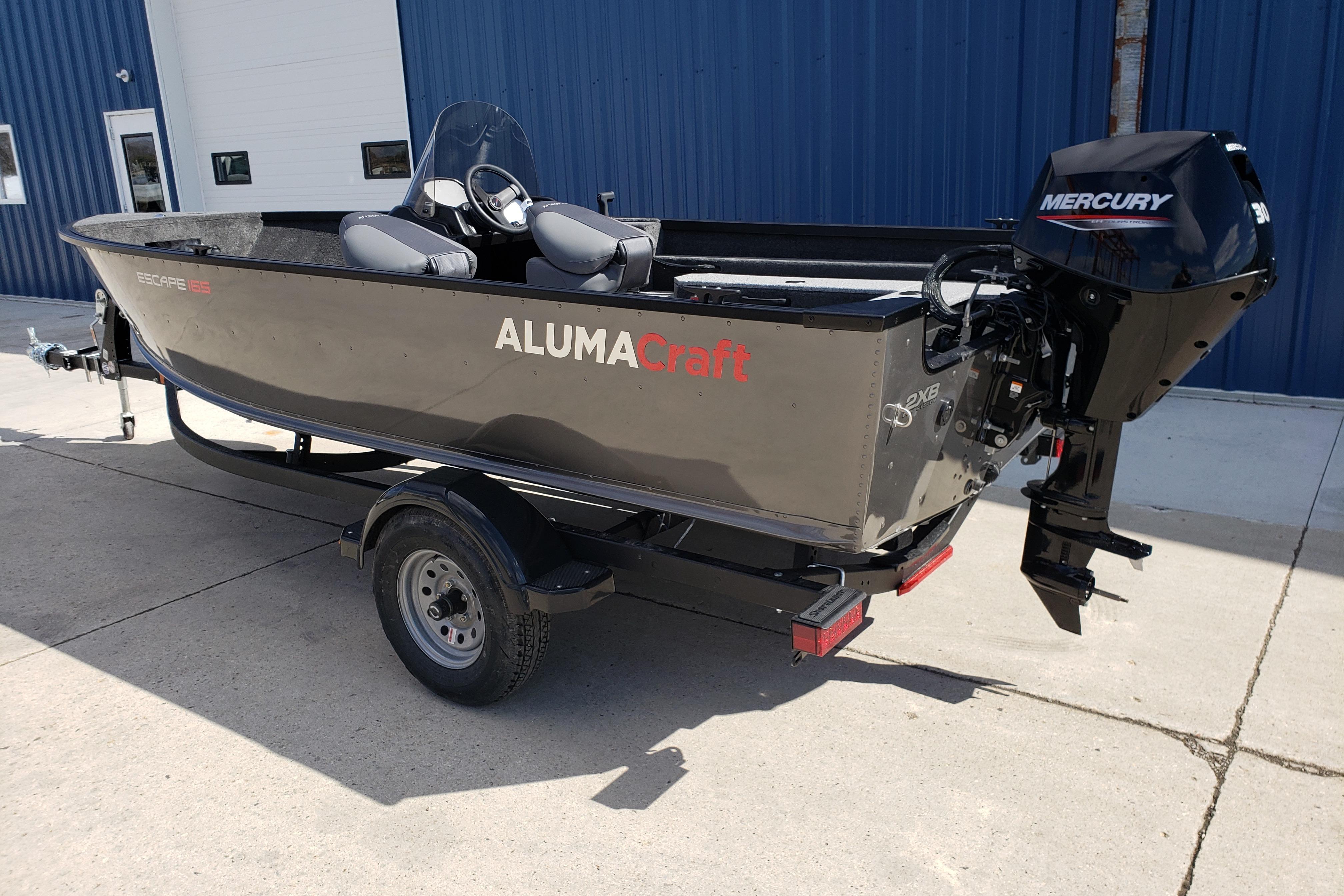 2026 Alumacraft Escape 165 CS boat with Mercury engine on trailer.